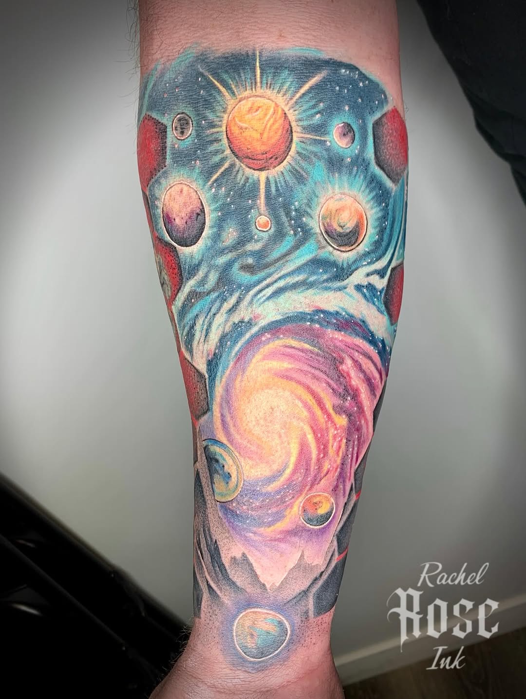 Galaxy and planets watercolor tattoo on the forearm by 𝑅𝒶𝒸𝒽𝑒𝓁 𝑅𝑜𝓈𝑒 🌹
