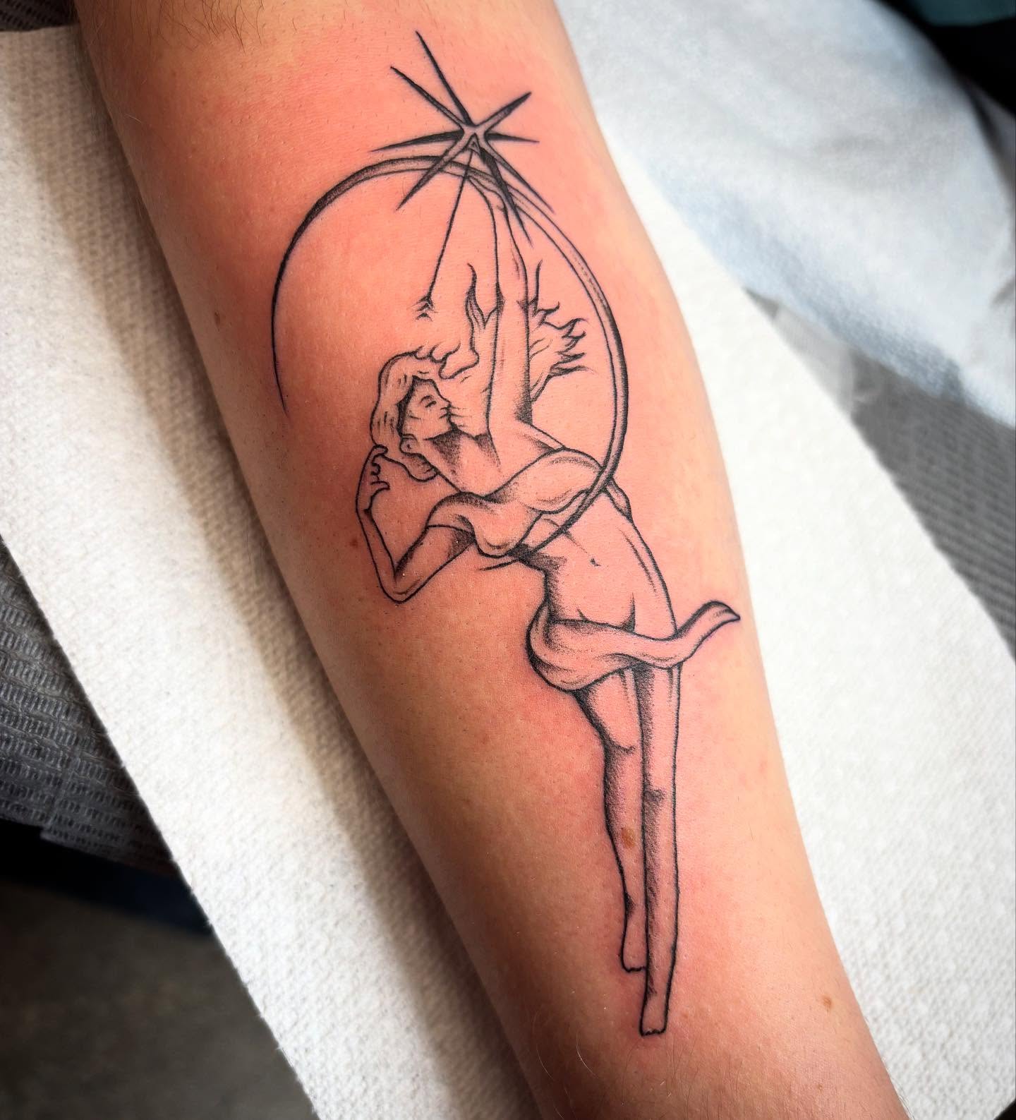 Acrobatic couple black and grey tattoo on the forearm by Brandi ⛓, Detroit, Michigan