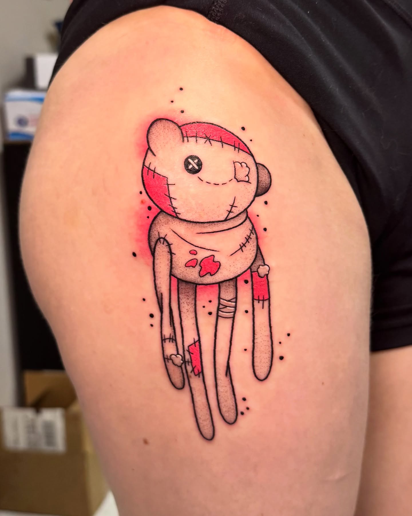 Stuffed toy dotwork tattoo on the shoulder by Eden Allen