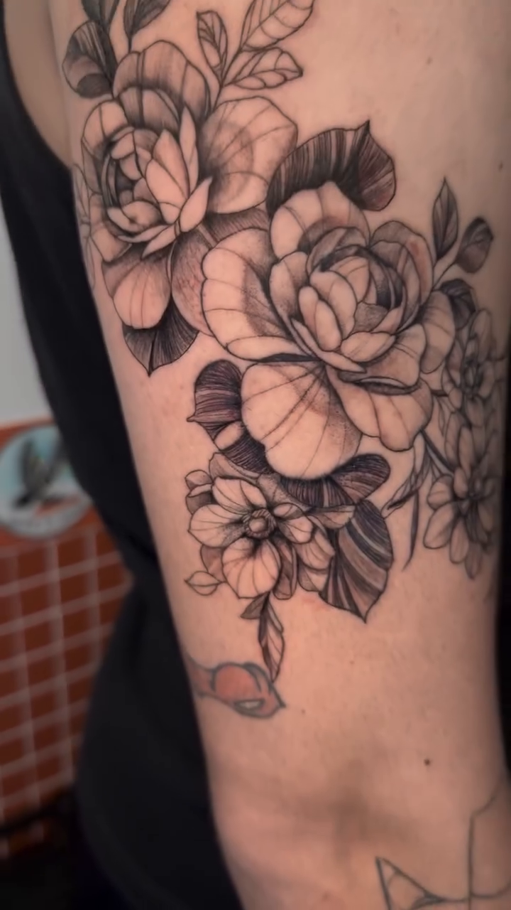 Floral arrangement fine line tattoo by Tiago Britto