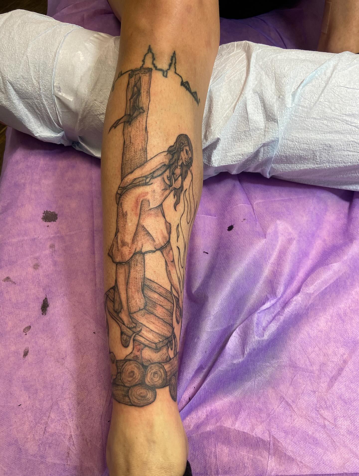 Crucifixion scene black and grey tattoo on the forearm by Dont Worry About It