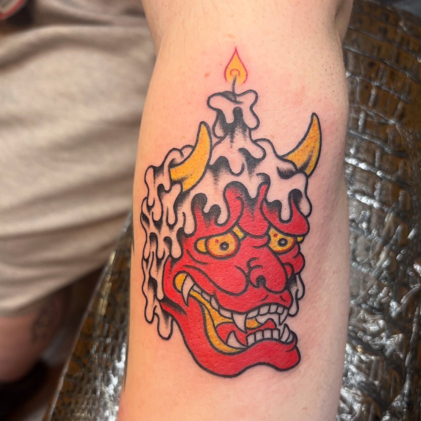 Demon candle American traditional tattoo on the forearm by Jordan Wray
