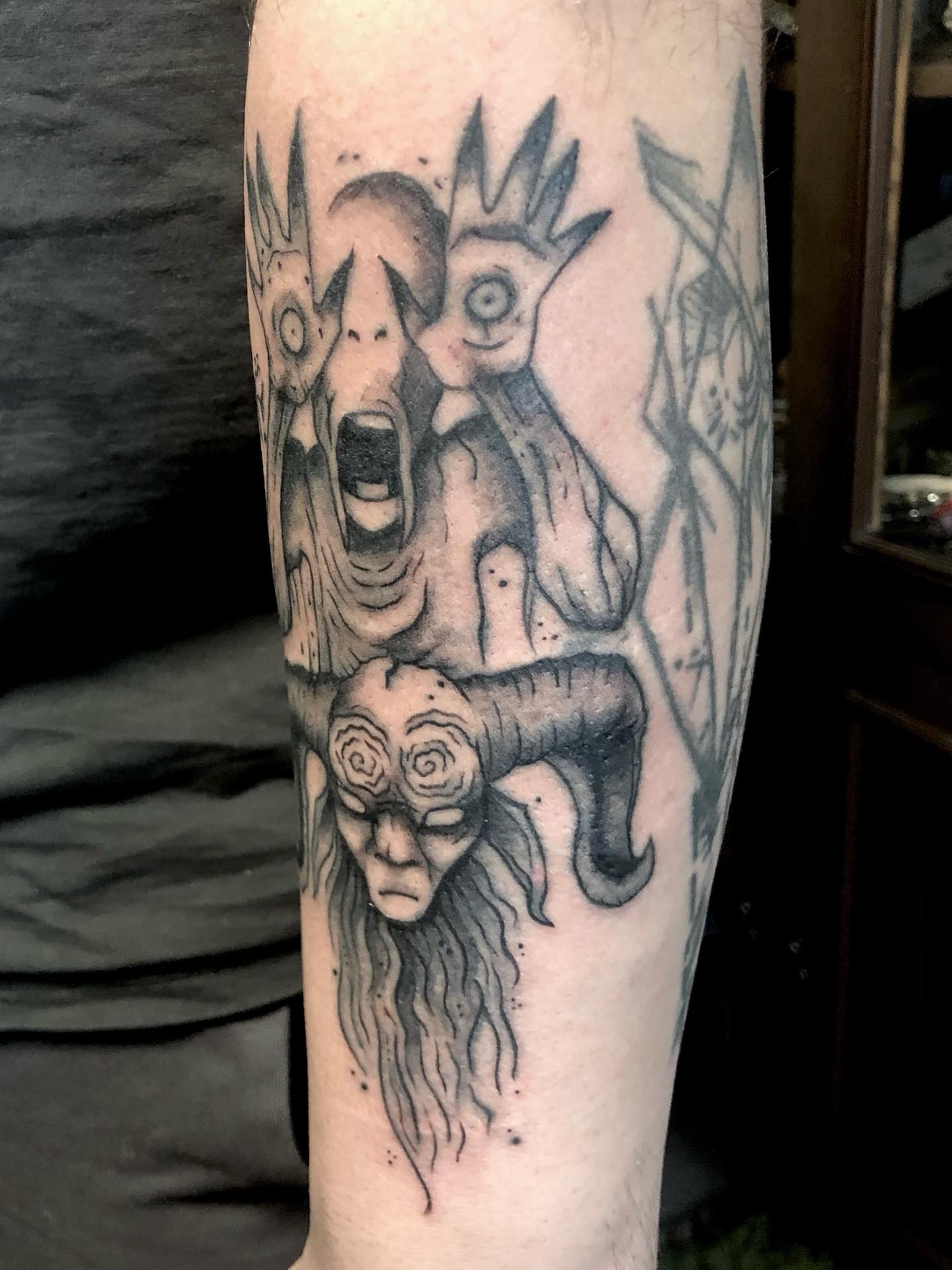 Abstract surrealistic figure surrealism tattoo on the forearm by Ink of Winchester