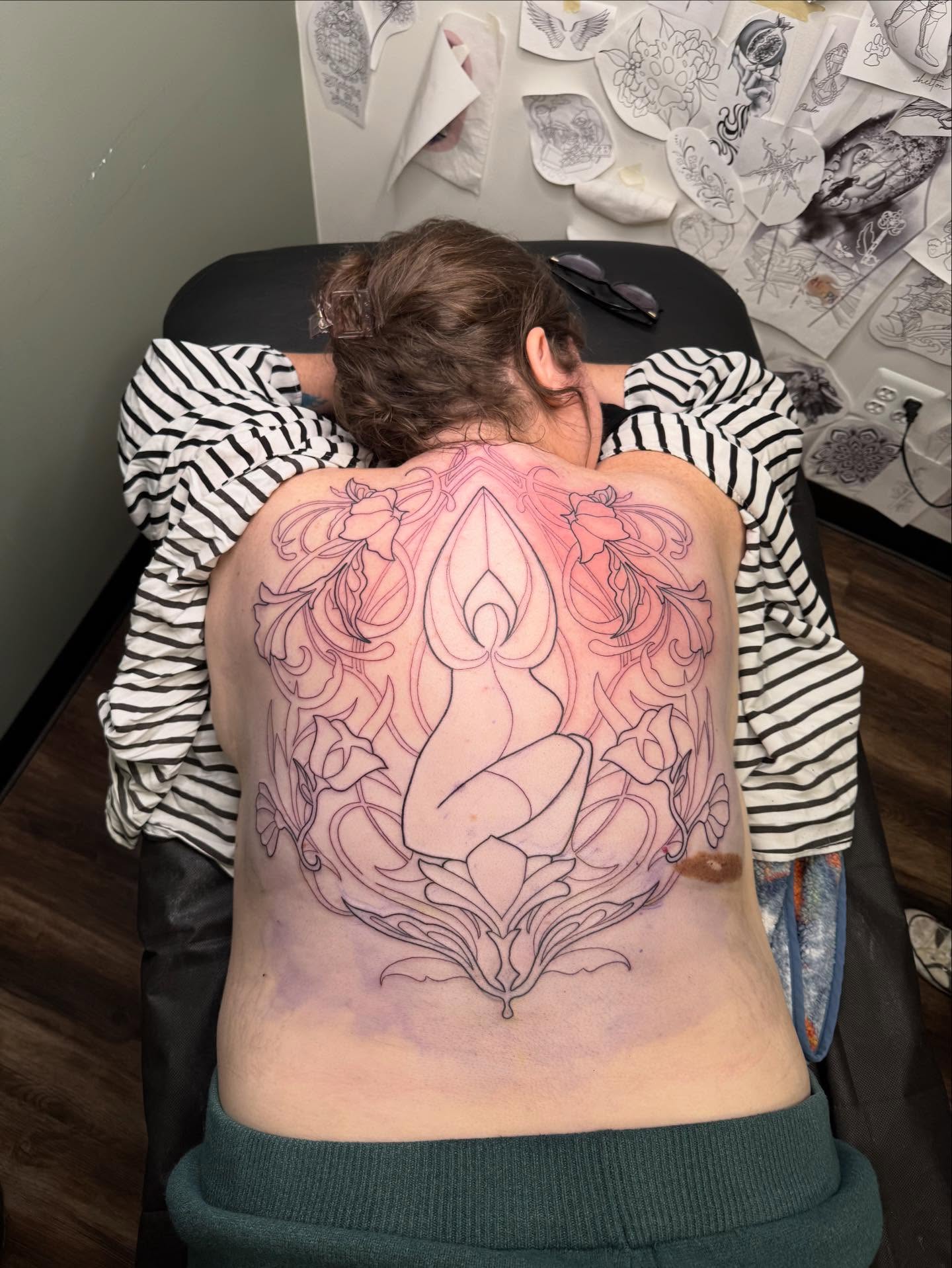 Lotus flower fine line tattoo on the back by Hi