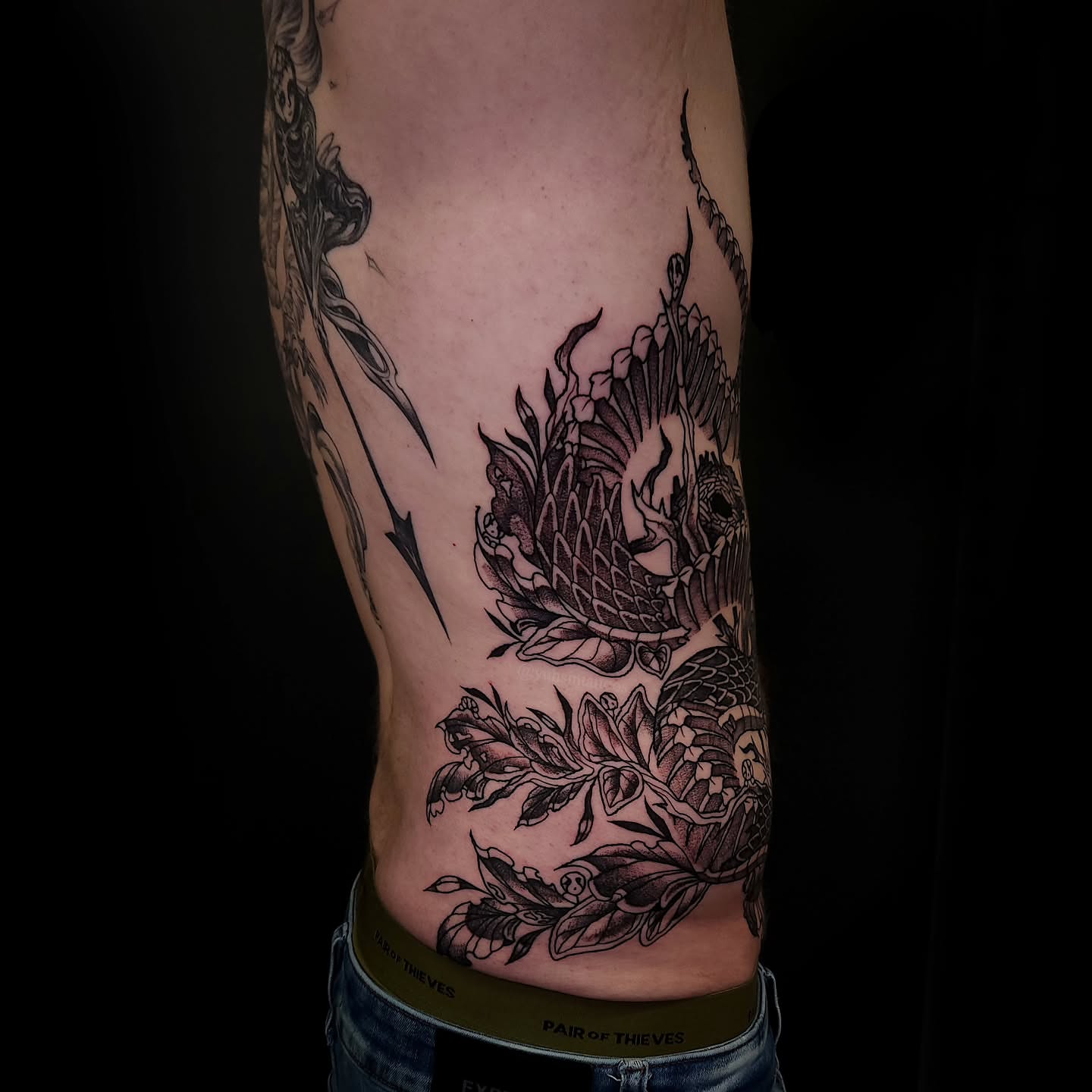 Dragon and flowers realism tattoo on the forearm by Sheena Yu-Hsin Wood