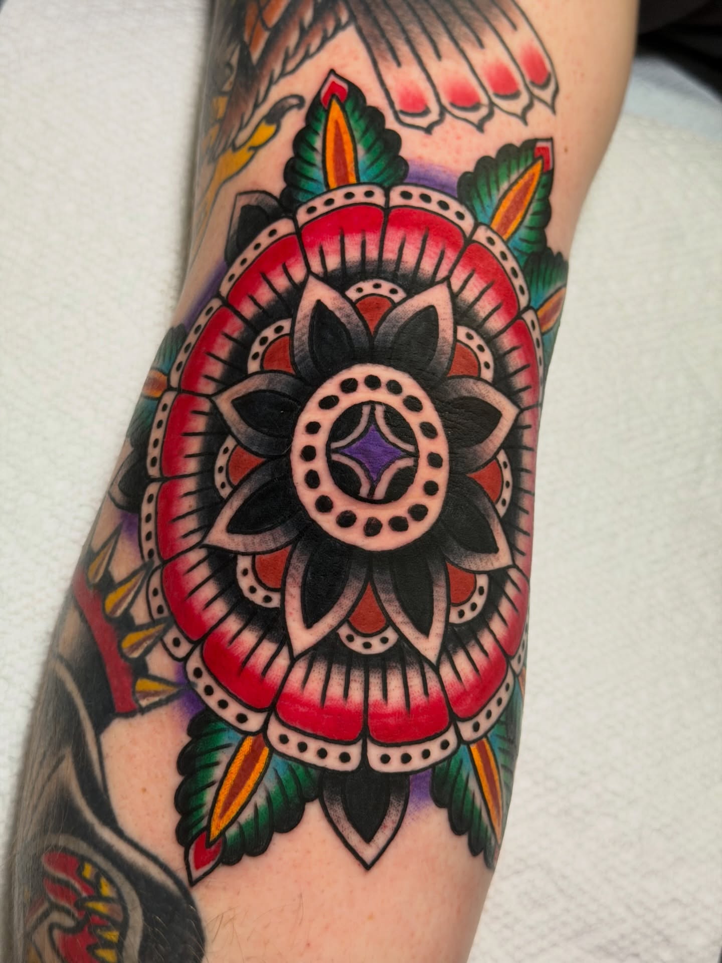 Mandala American traditional tattoo on the forearm by Brandon Bear