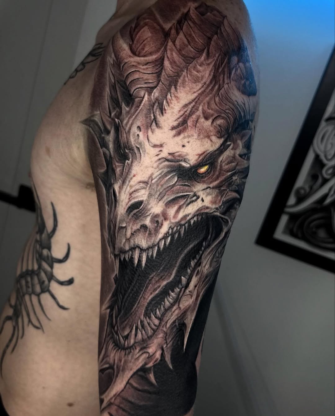Dragon head realism tattoo on the forearm by Jayden A