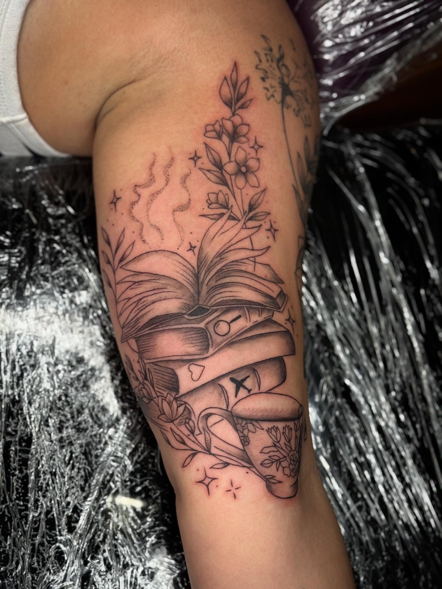 Book and flowers black and grey tattoo on the forearm by Ashley Hsiung *Panda*