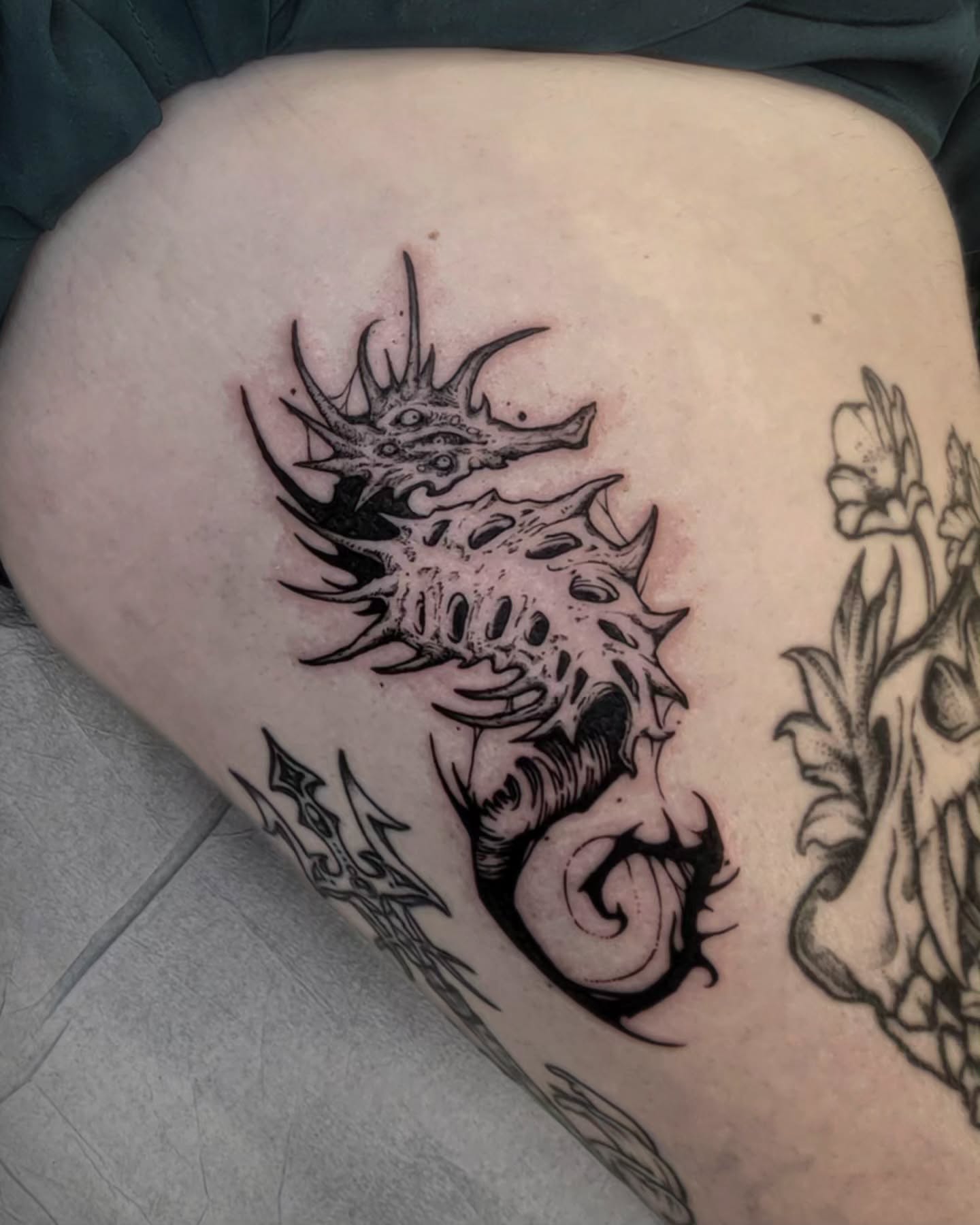 Seahorse black and grey tattoo on the thigh by Luca
