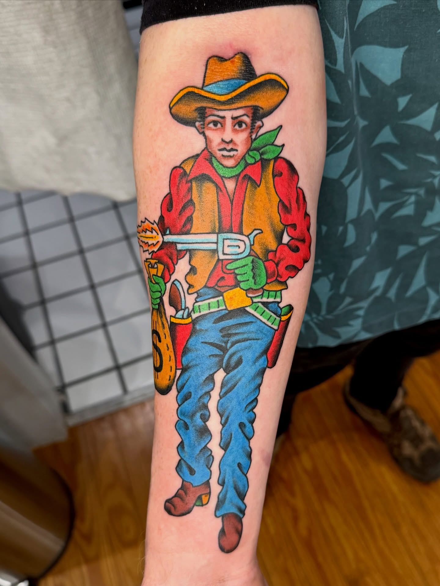 Cowboy character American traditional tattoo on the forearm by Zak Colburn
