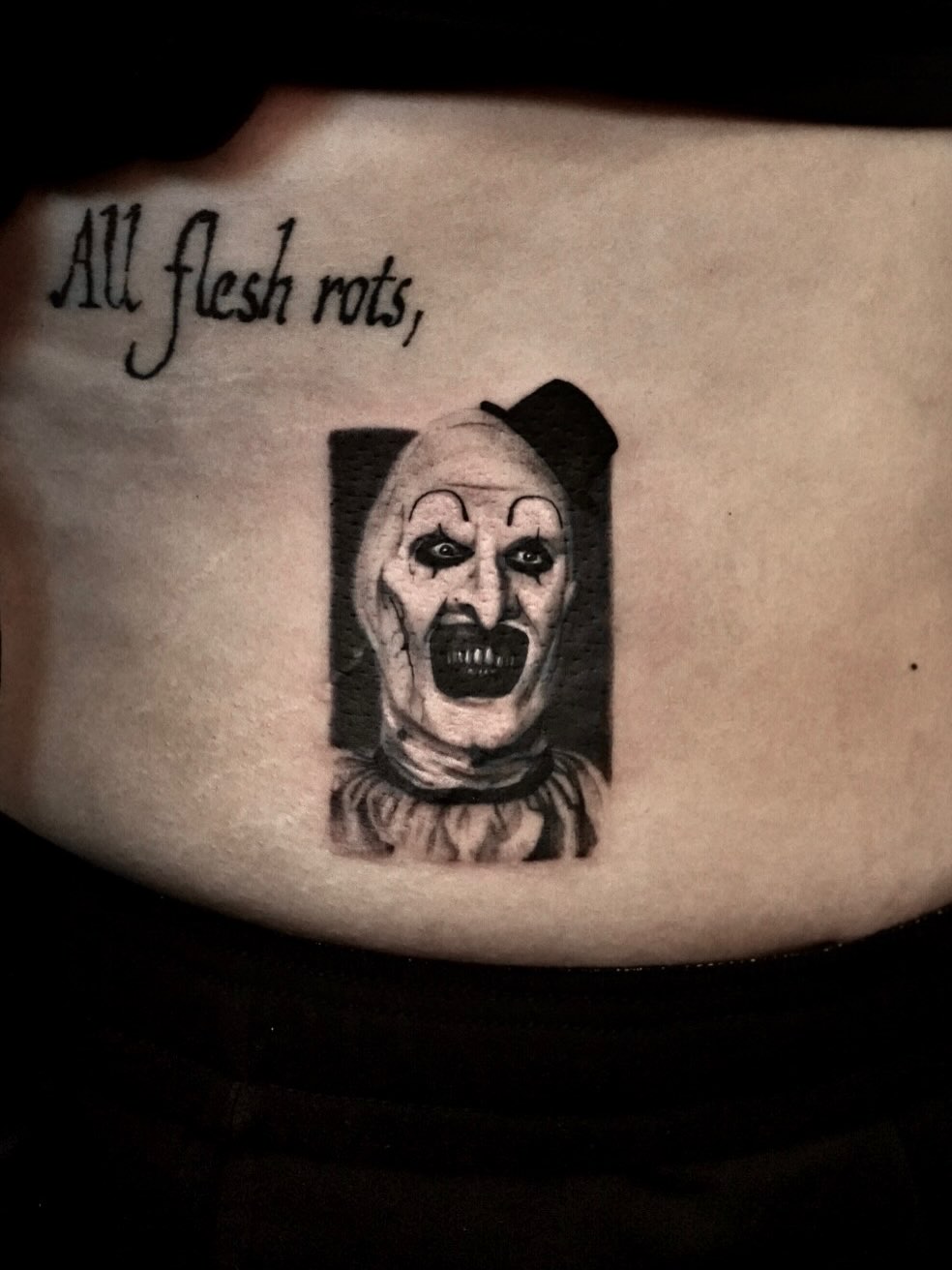 Clown black and grey tattoo by Tattoo Artist