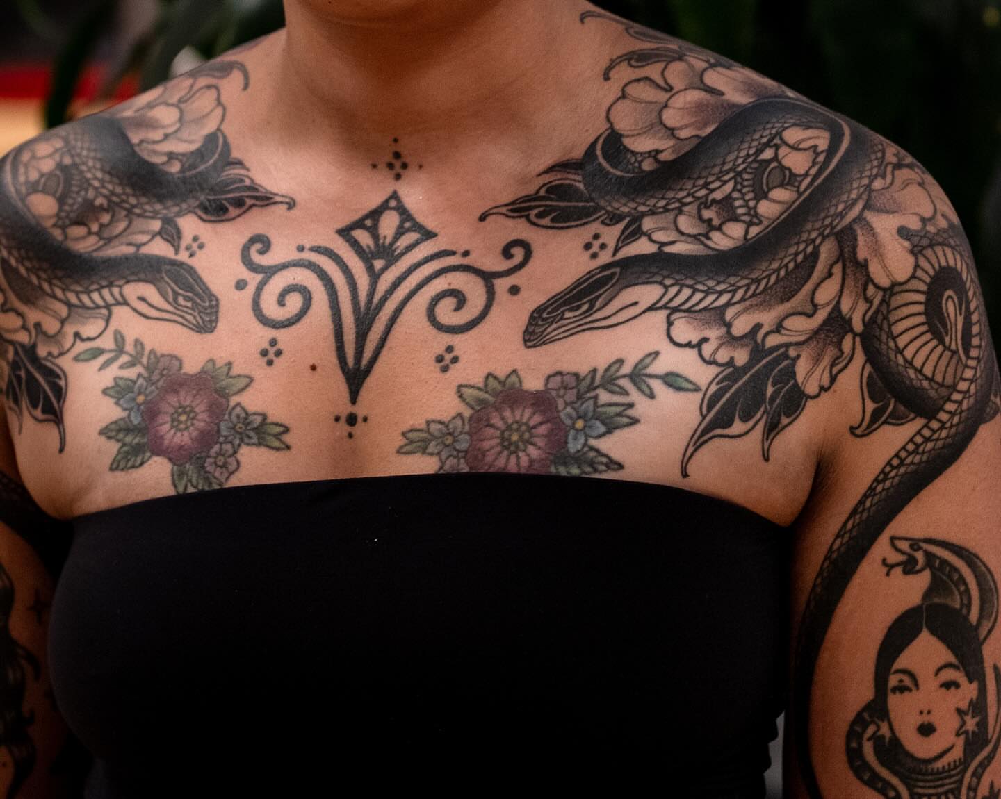 Snake and floral geometric tattoo on the chest by Matt Leibo, San Francisco, California