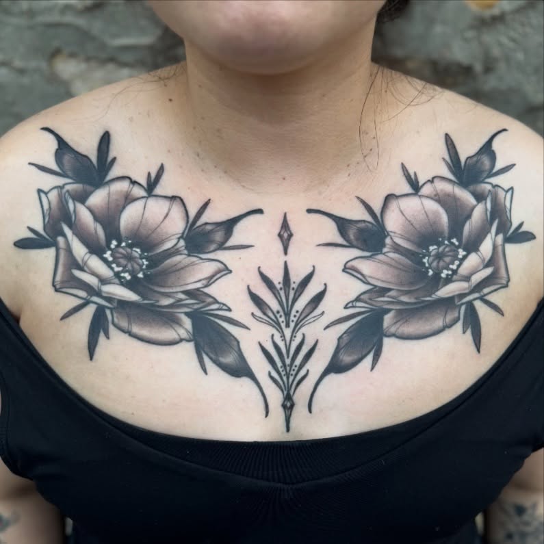 Floral arrangement geometric tattoo on the chest by Erin Bratzler