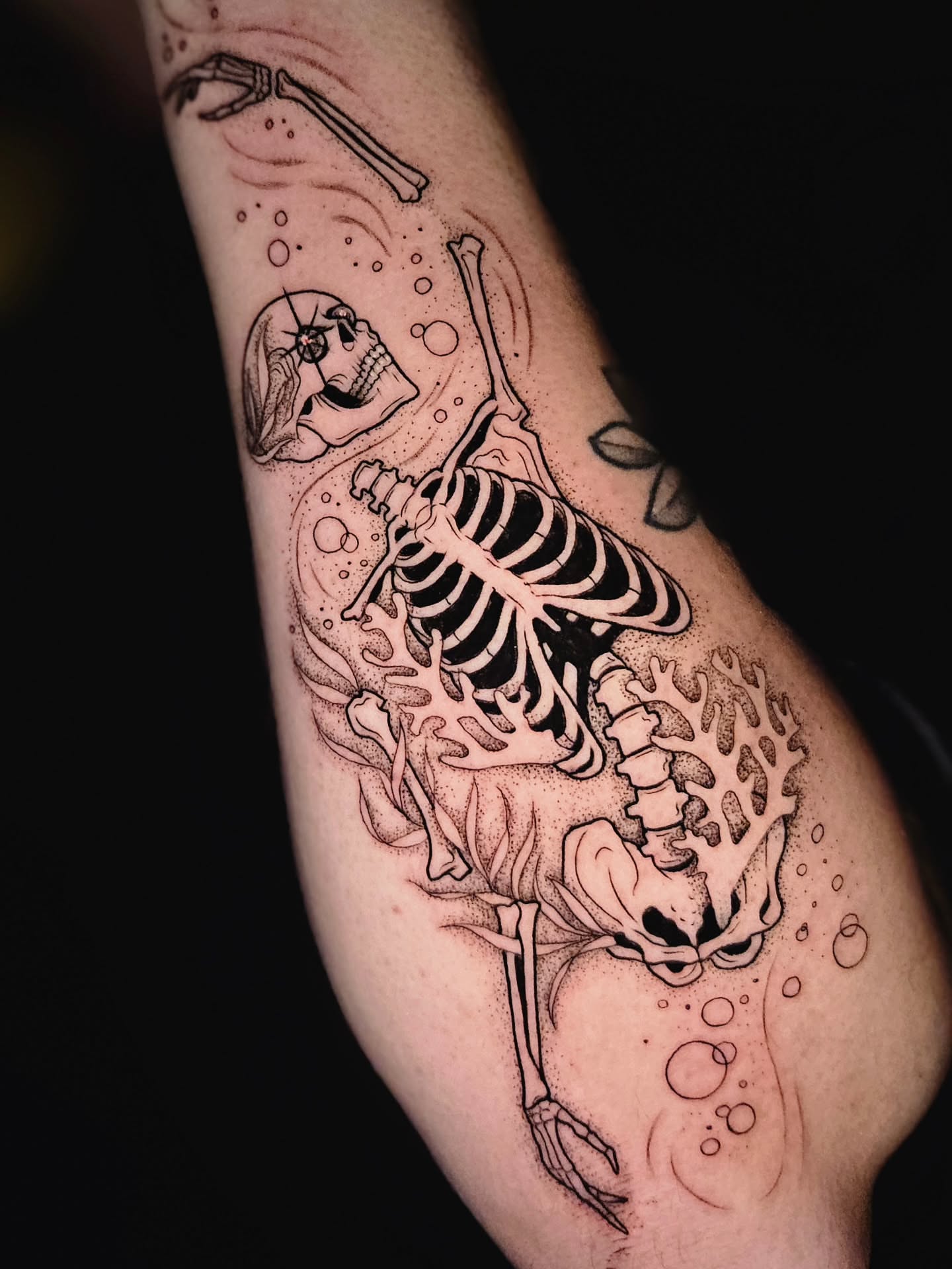 Skeleton dotwork tattoo on the forearm by Courtlyn Bliss
