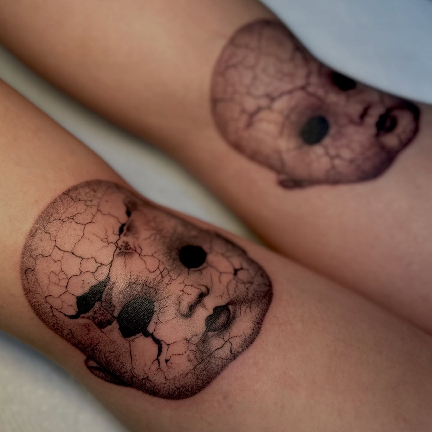 Abstract cracked surface dotwork tattoo on the forearm by Ghost