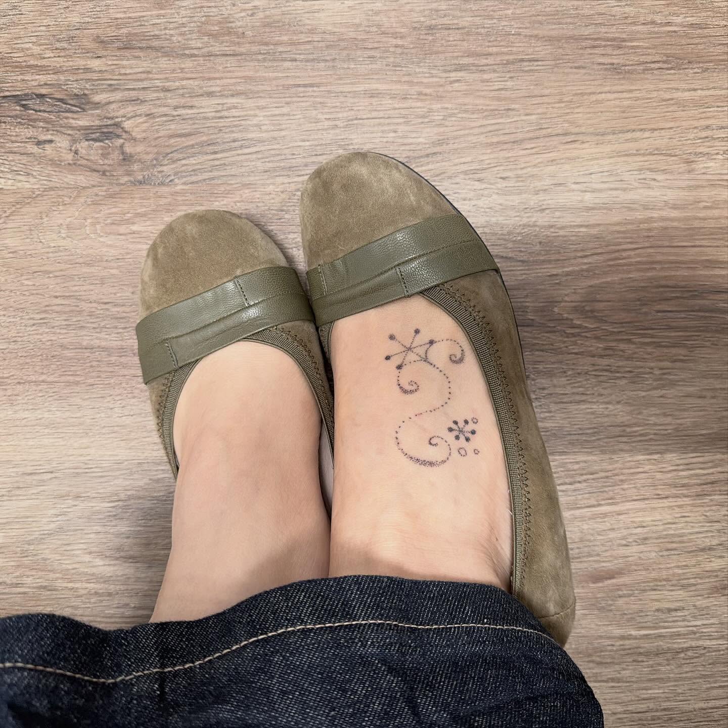 Astral symbol dotwork tattoo on the foot by kari