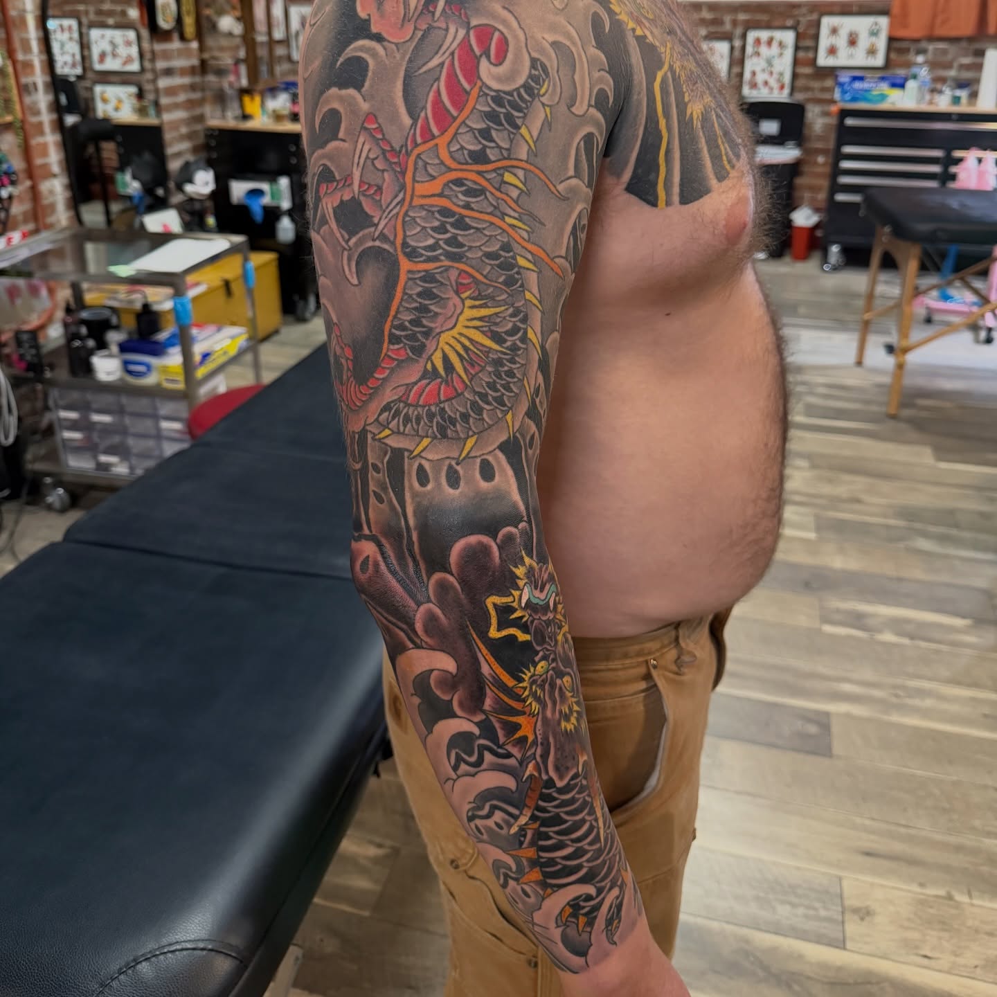 Dragon japanese irezumi tattoo on the upper arm by Trevor Berry