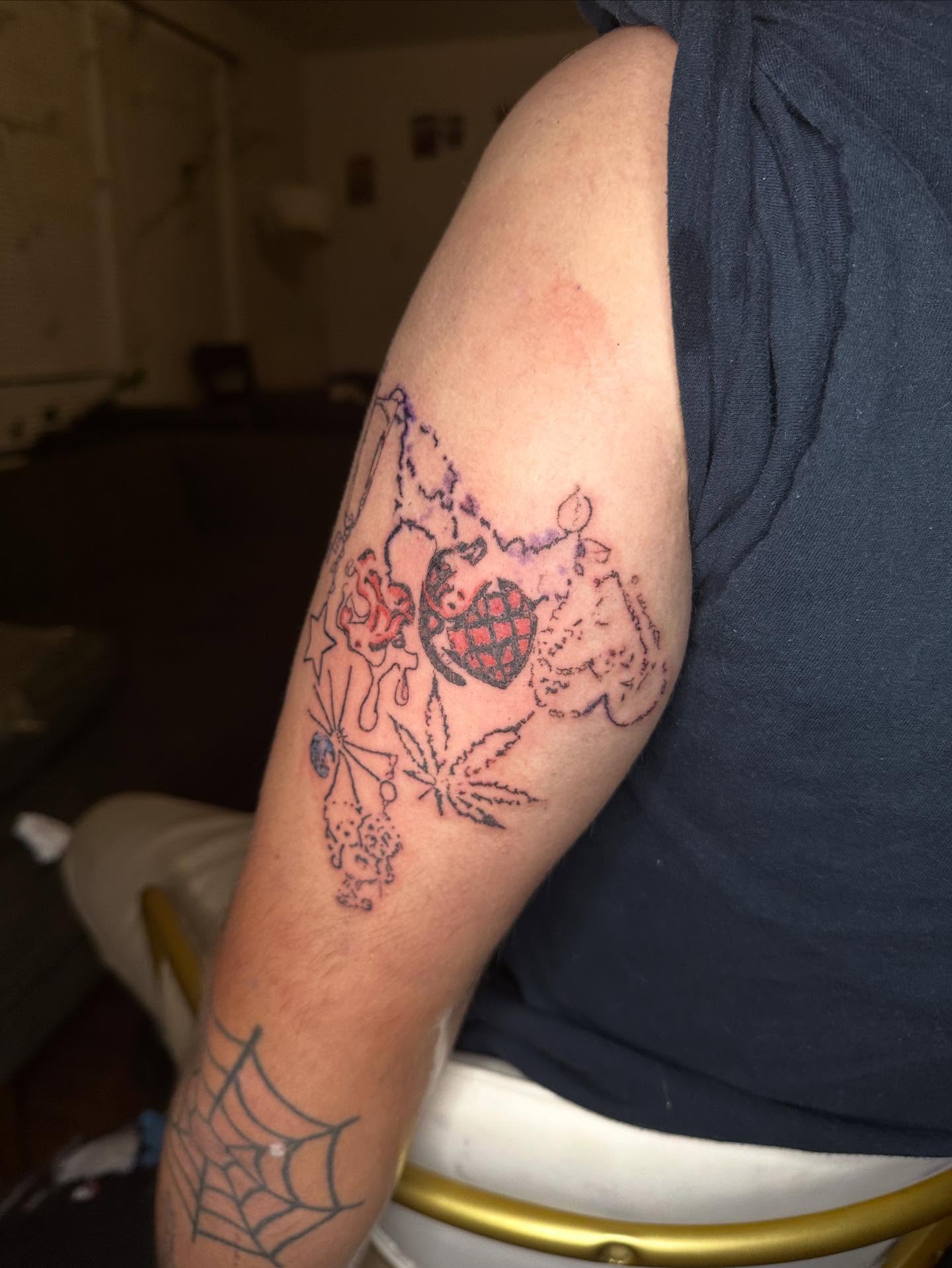 Marijuana leaf and pipe American traditional tattoo on the forearm by Swag Originator
