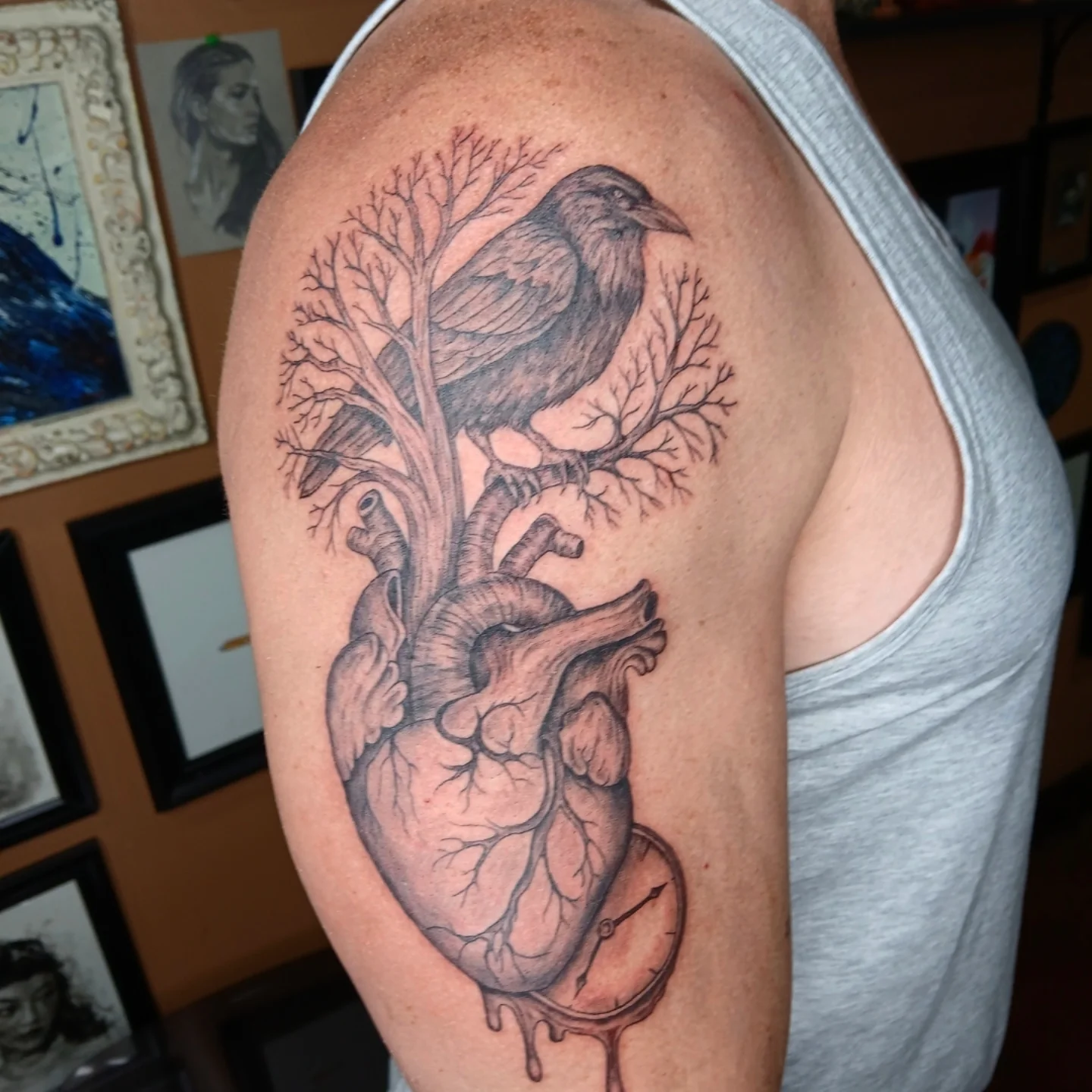 Heart and crow realism tattoo on the shoulder by Chris Bell