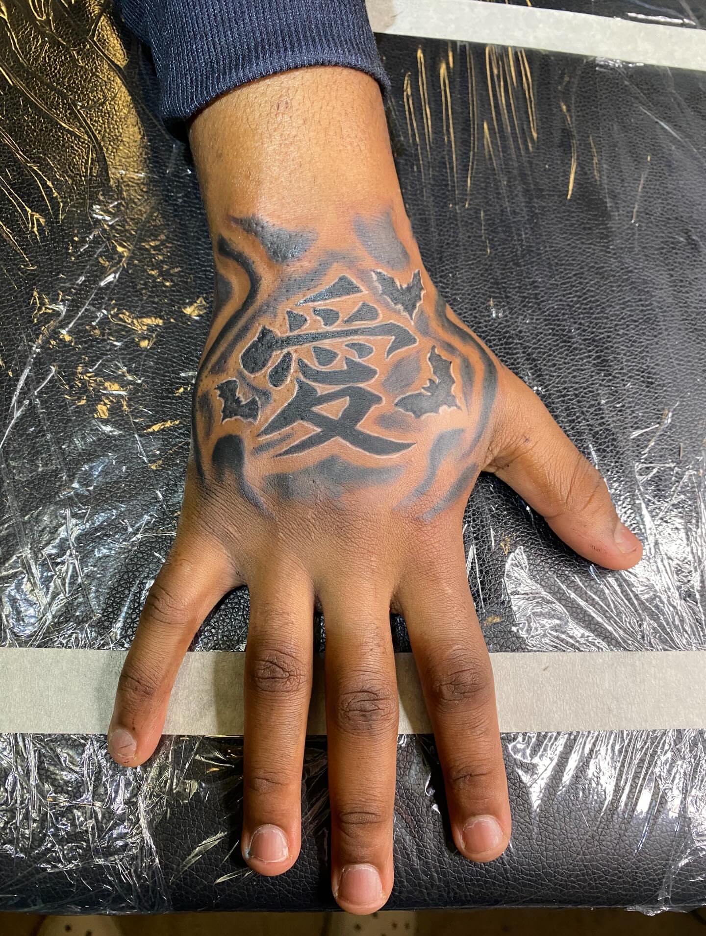 Kanji character tribal tattoo on the hand by Illuminink.gallery
