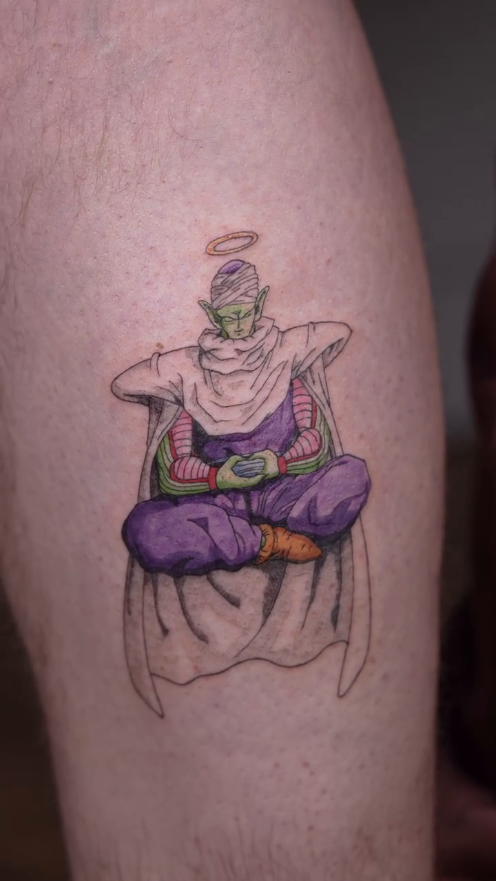 Piccolo meditating anime tattoo on the forearm by Jennifer Fuster