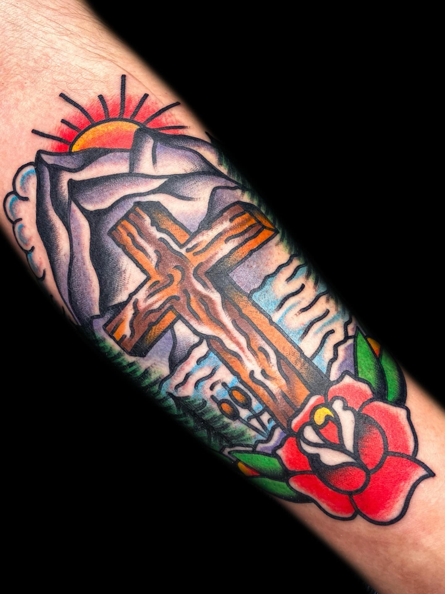 Cross and rose American traditional tattoo on the forearm by The Calamari Kid