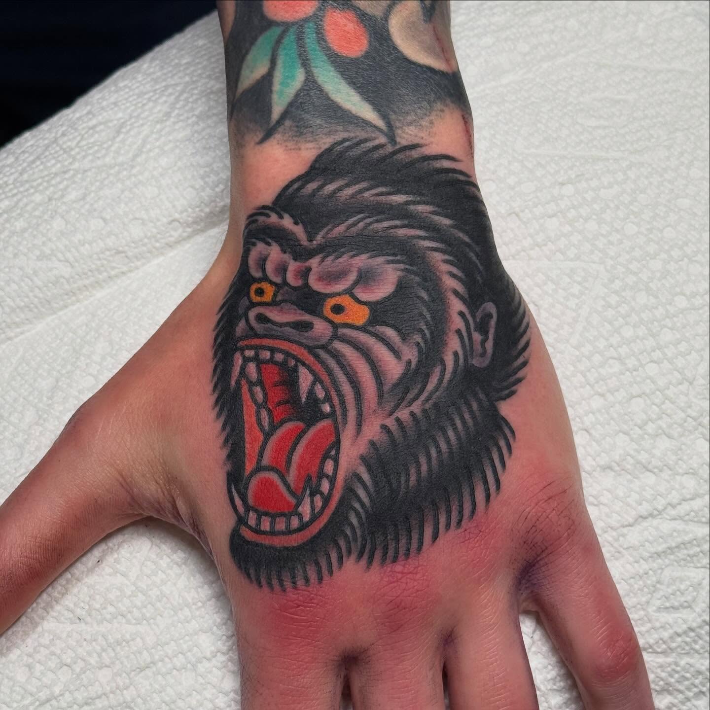 Gorilla American traditional tattoo on the hand by Zach Roman, Madison, Wisconsin
