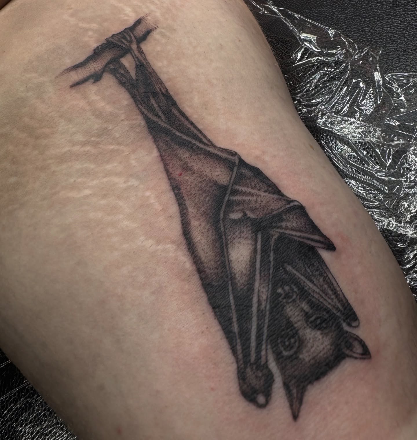 Bat black and grey tattoo on the thigh by Saffron Florea, Tiffin, Ohio