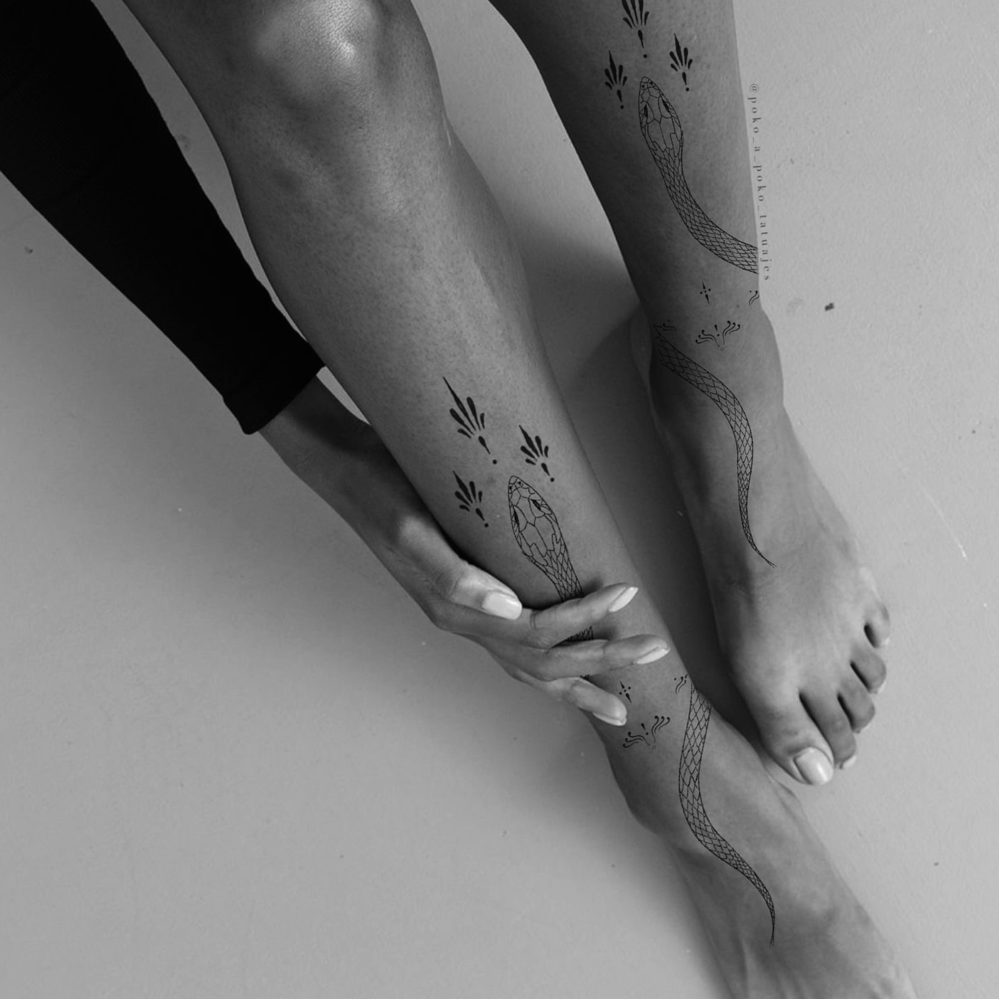 Snake black and grey tattoo on the leg by @ethereal.ornamentalism