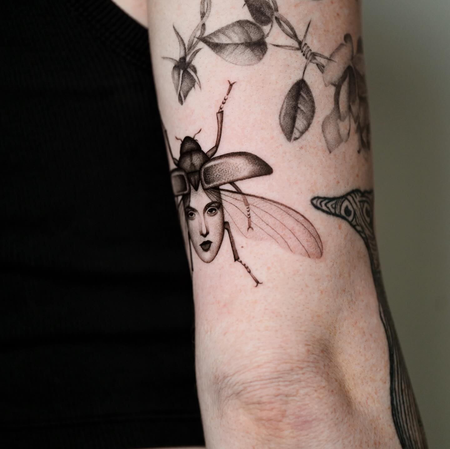 Insect with human face realism tattoo on the forearm by dom