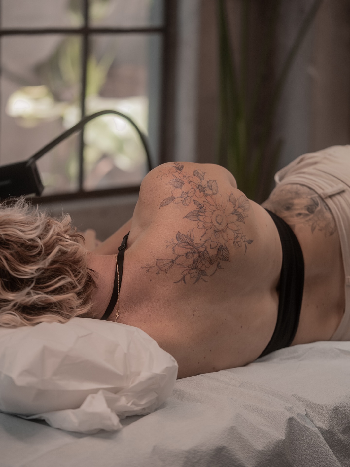 Floral design black and grey tattoo on the back by Mary Shekh