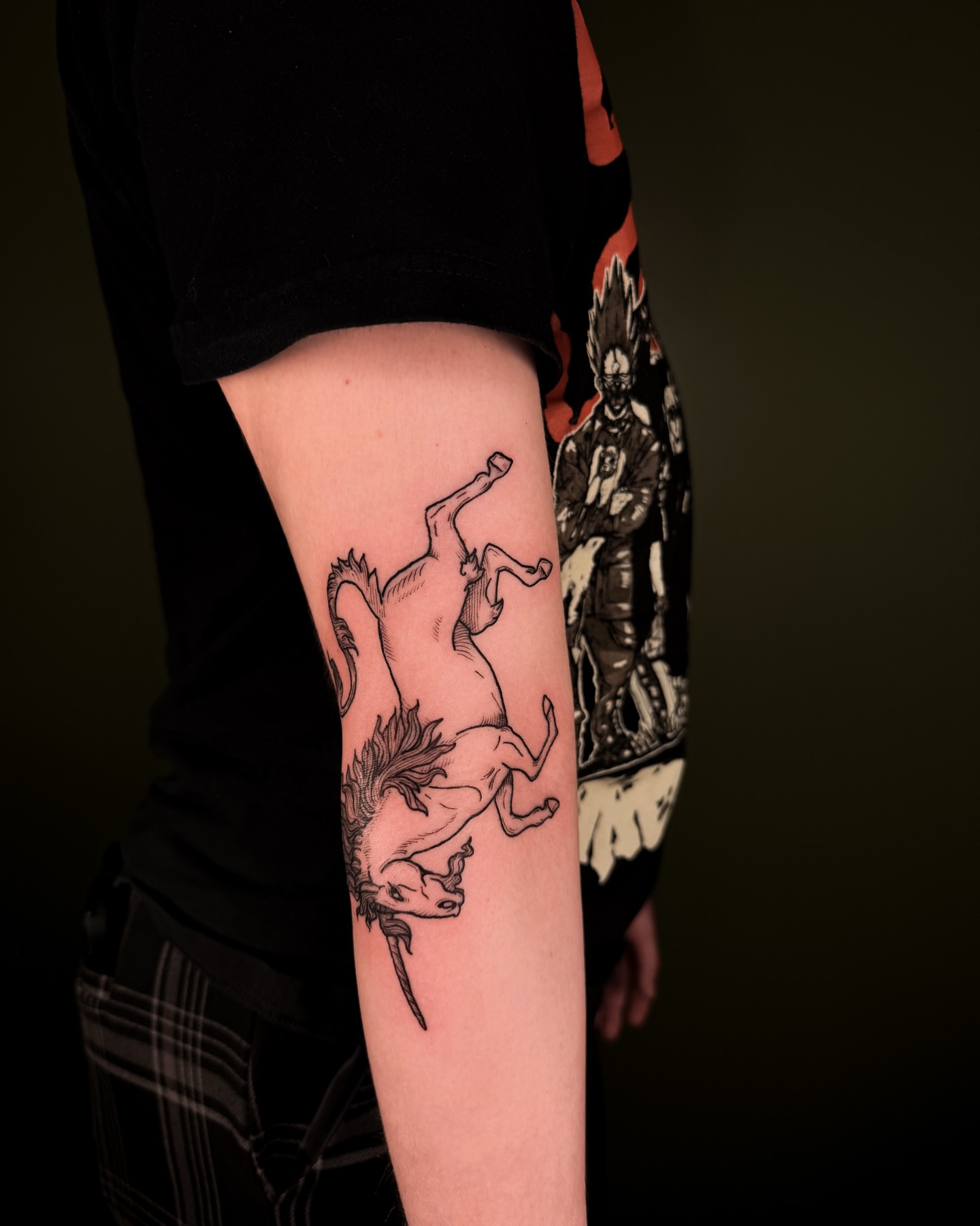 Unicorn black and grey tattoo on the forearm by Zella Mäkelä