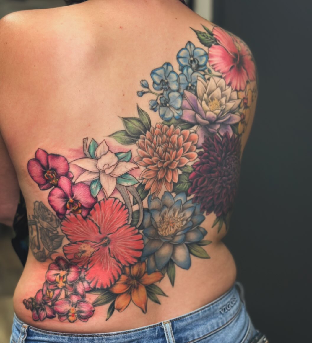Floral bouquet realism tattoo on the back by Classy Fucking Lady Tattooer