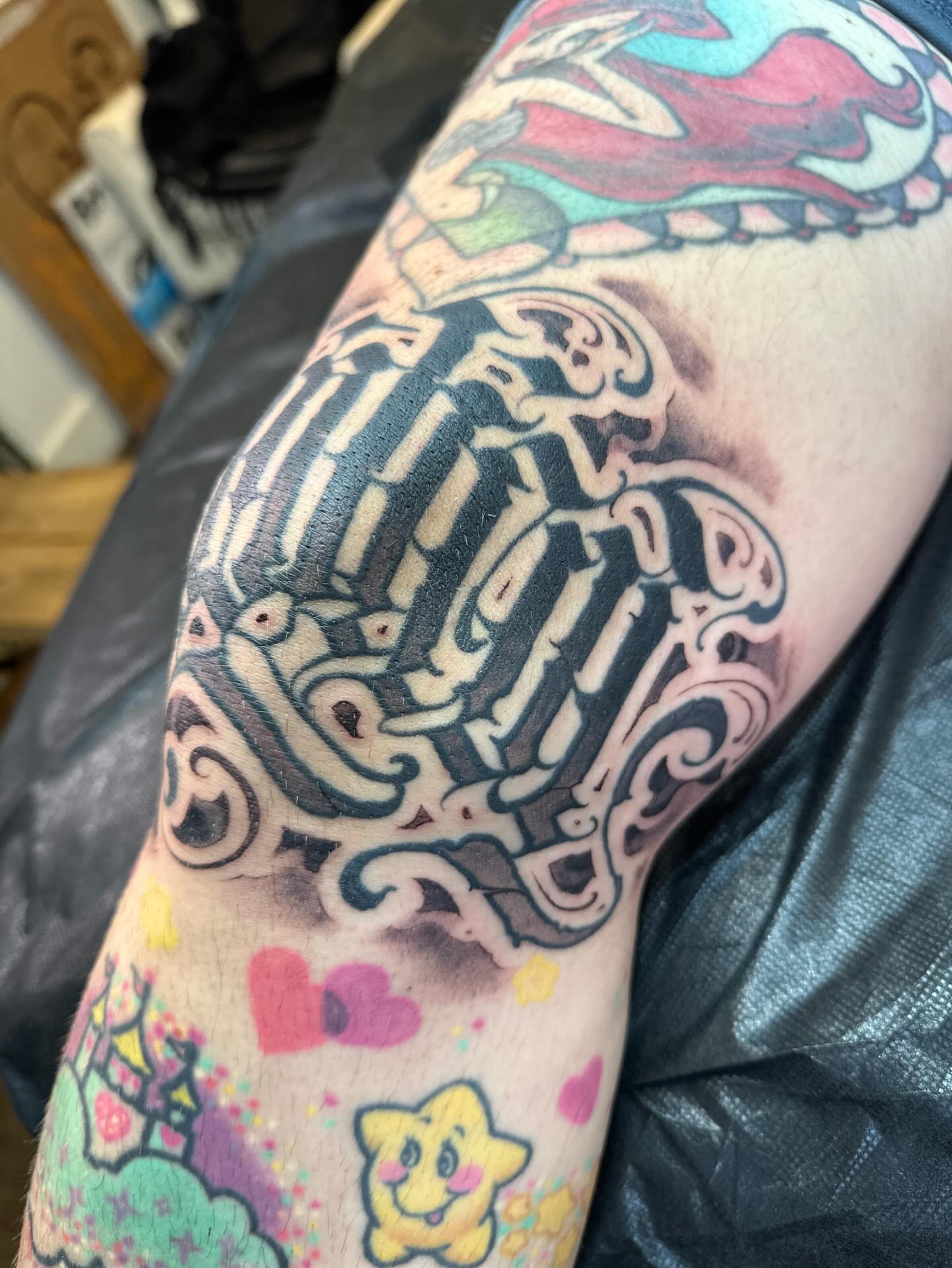 Geometric skeleton geometric tattoo on the upper arm by Tattoos By Deft