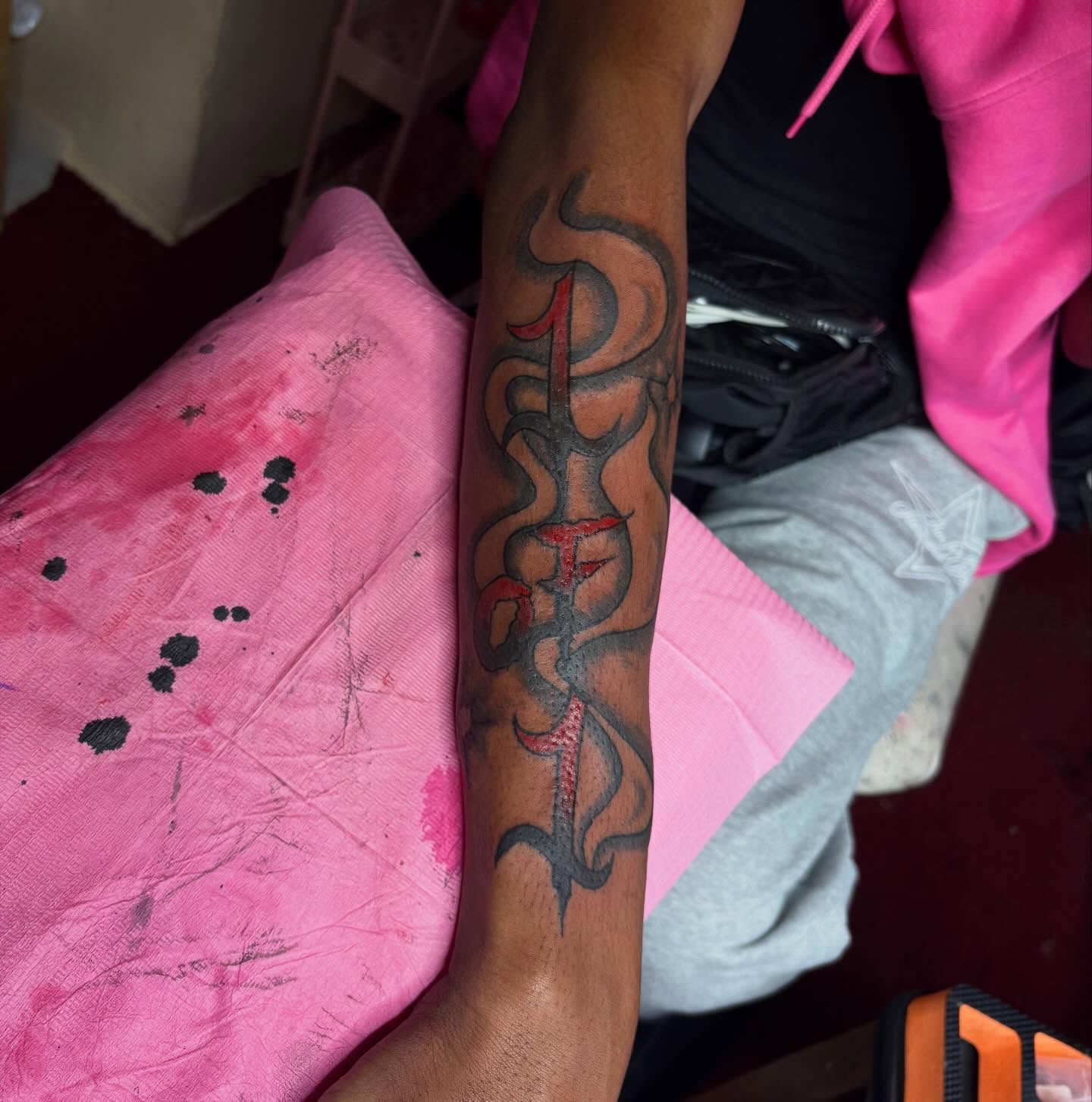 Flame and cross black and grey tattoo on the forearm by Barbinks Studio🎀