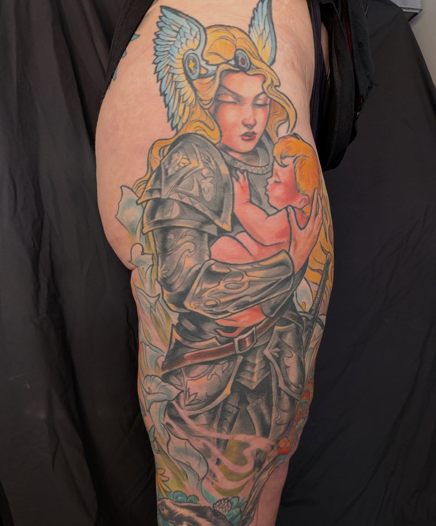 Guardian angel holding child illustrative tattoo on the forearm by Nic Skrade, Minneapolis, Minnesota
