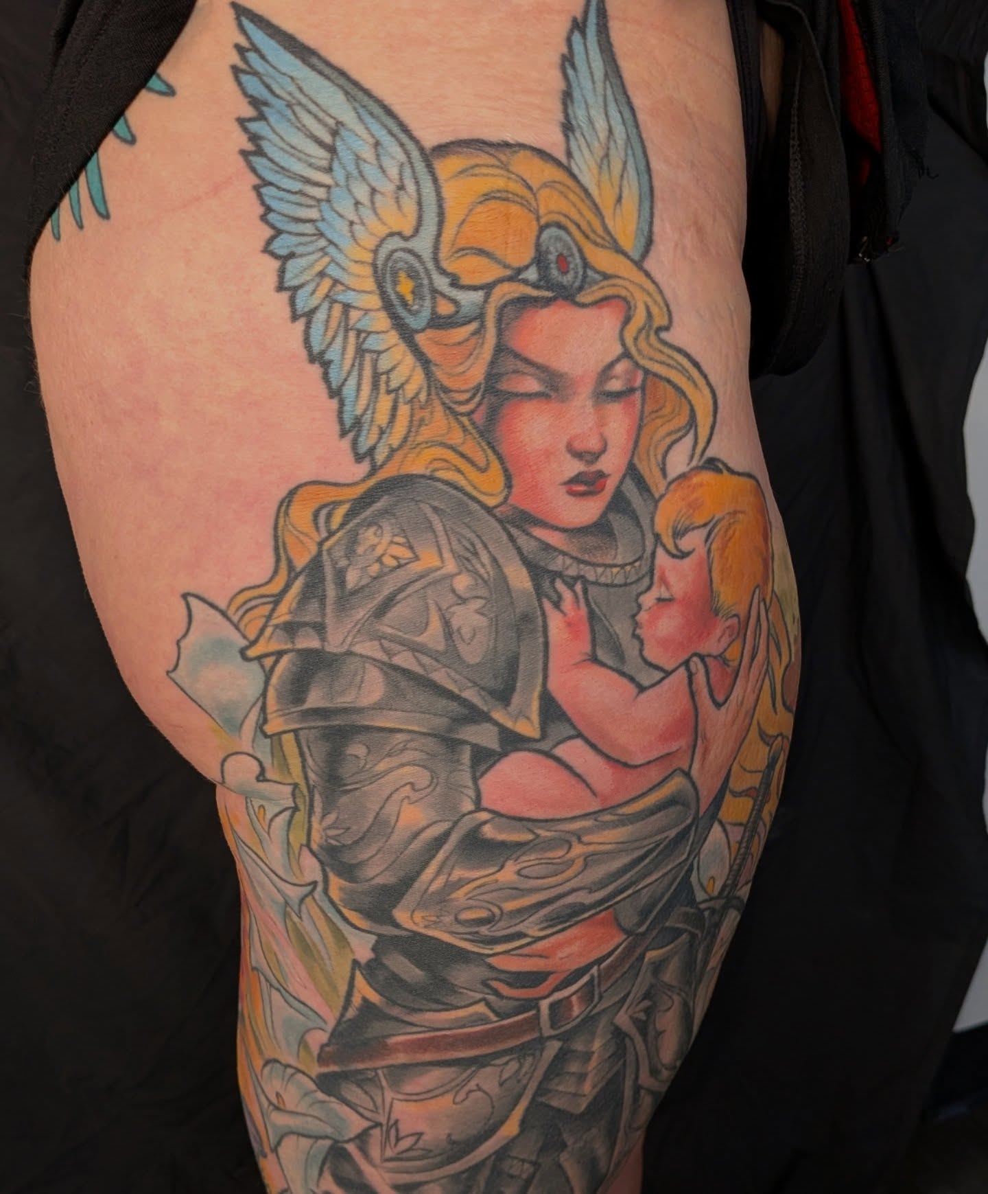 Angelic warrior holding child American traditional tattoo on the upper arm by Nic Skrade, Minneapolis, Minnesota