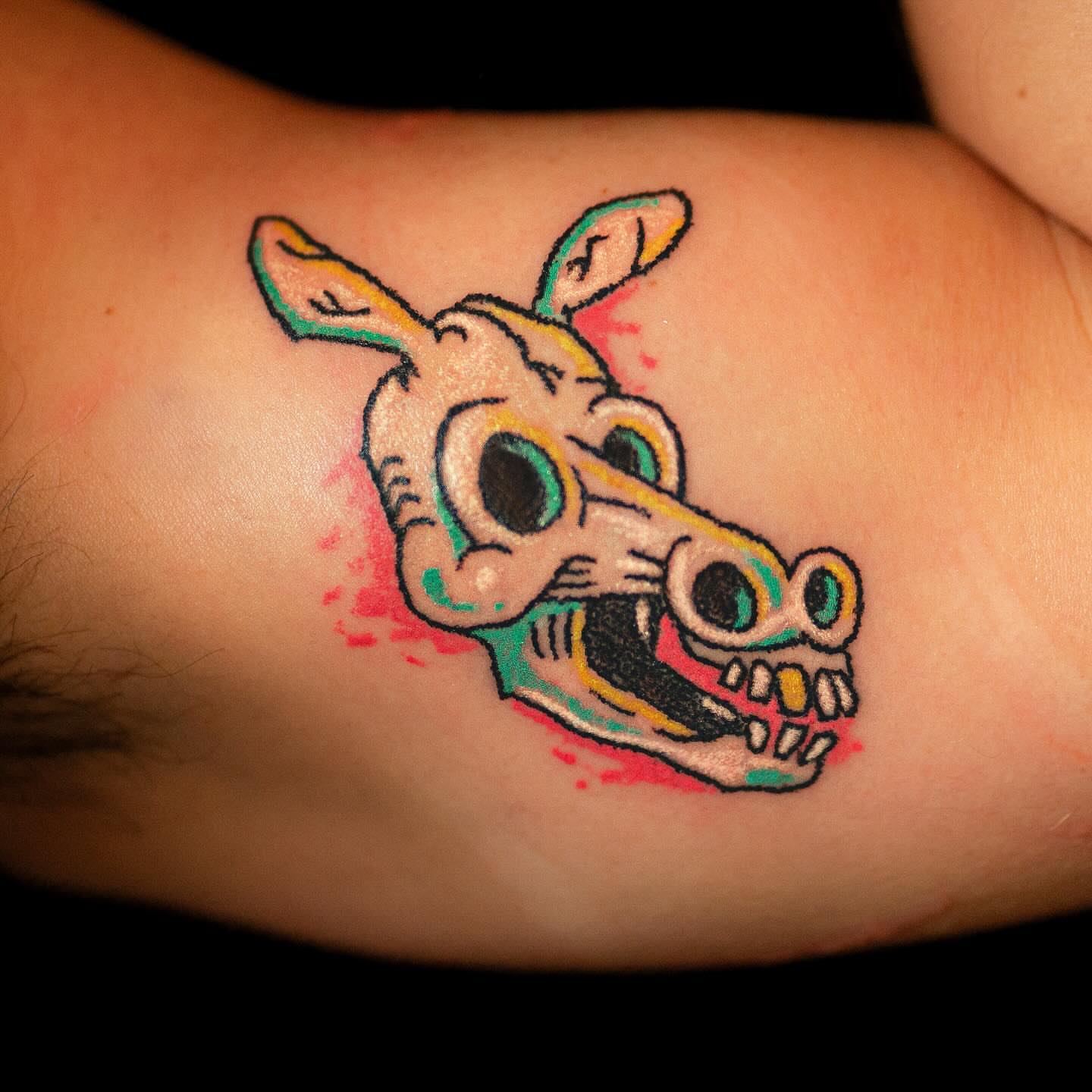 Dog skull American traditional tattoo on the forearm by Flash Boom Bang Tattoo