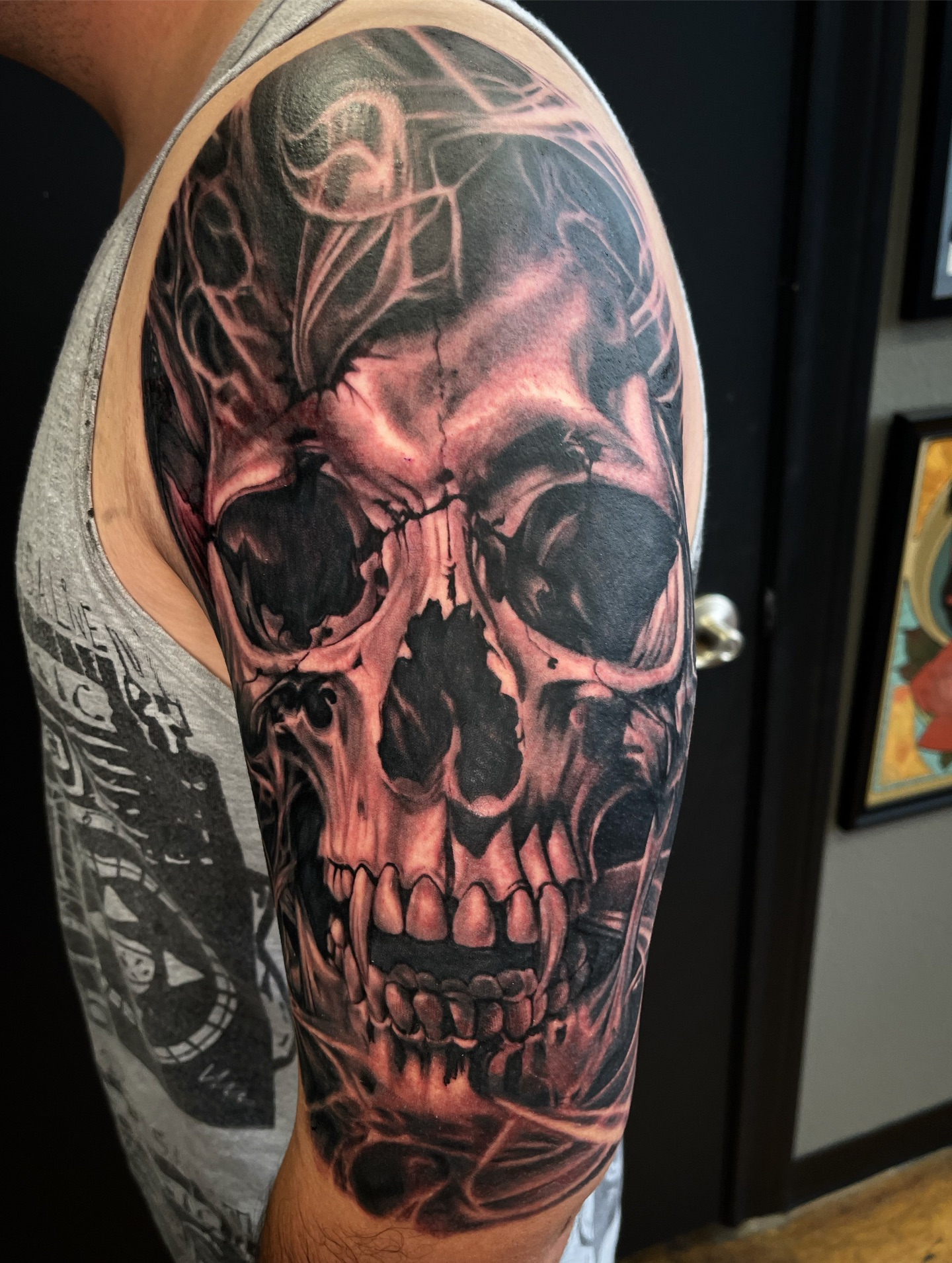 Skull realism tattoo on the upper arm by @tattoos_by_elijah