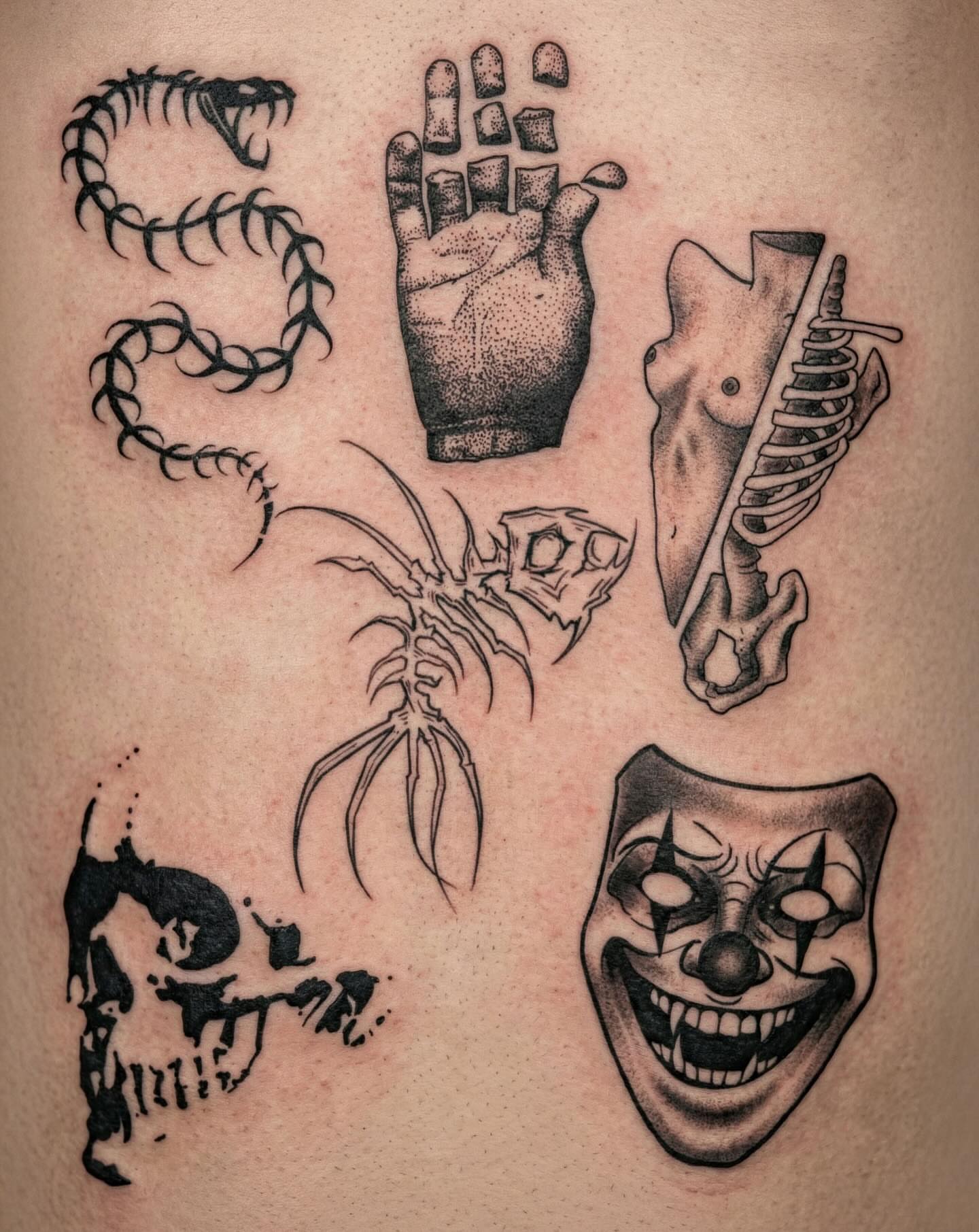 Clown mask black and grey tattoo on the thigh by Imani