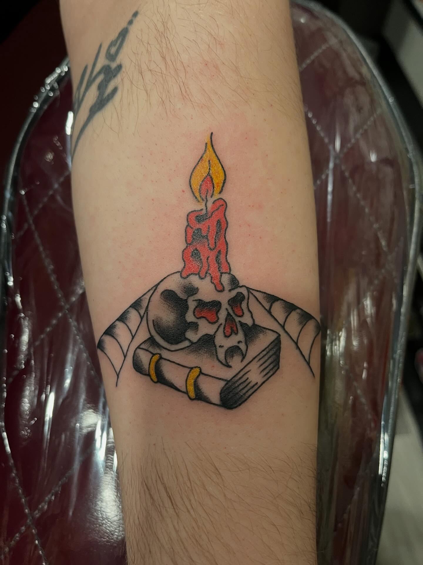 Candle and skull black and grey tattoo on the forearm by P R O P H e T T R A V I S