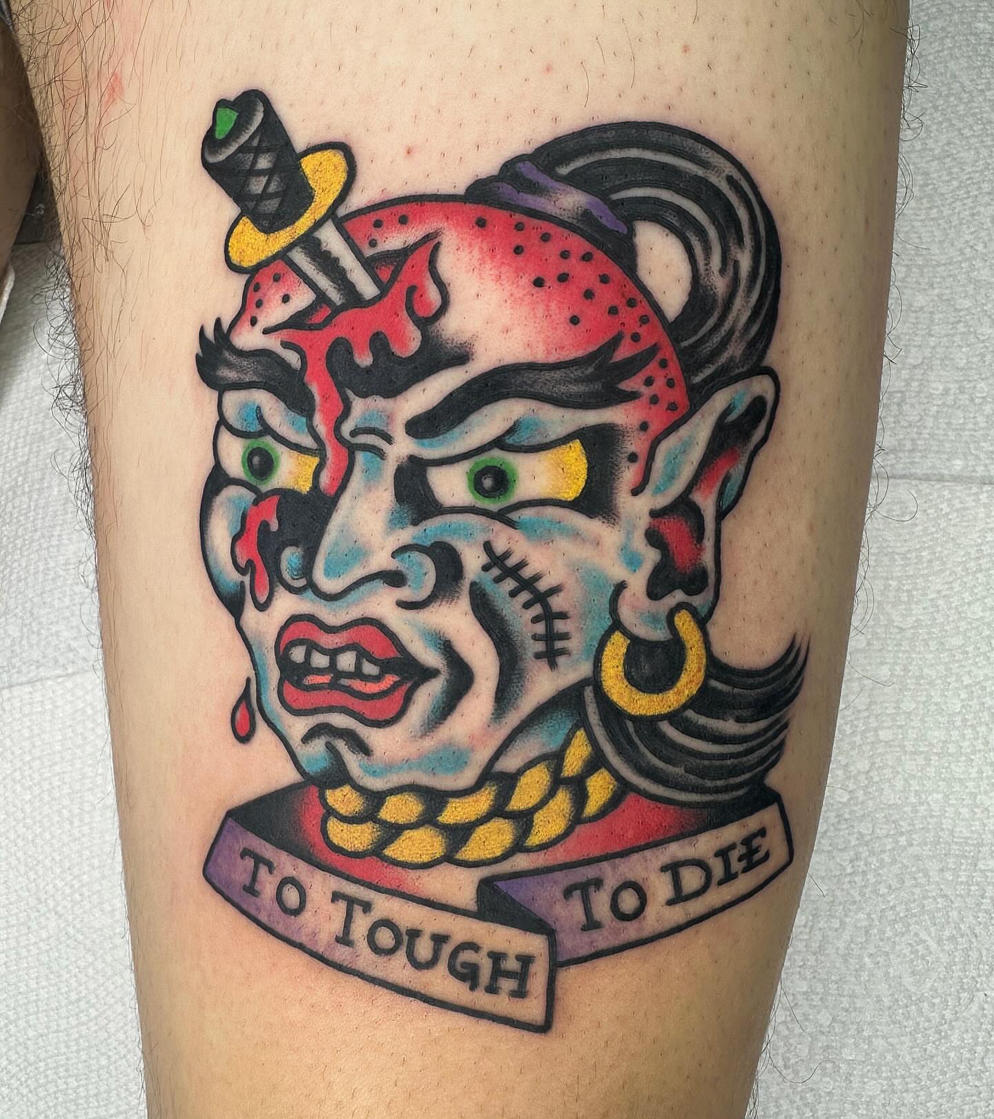 Japanese mask American traditional tattoo on the forearm by David Devaney, Knoxville, Tennessee