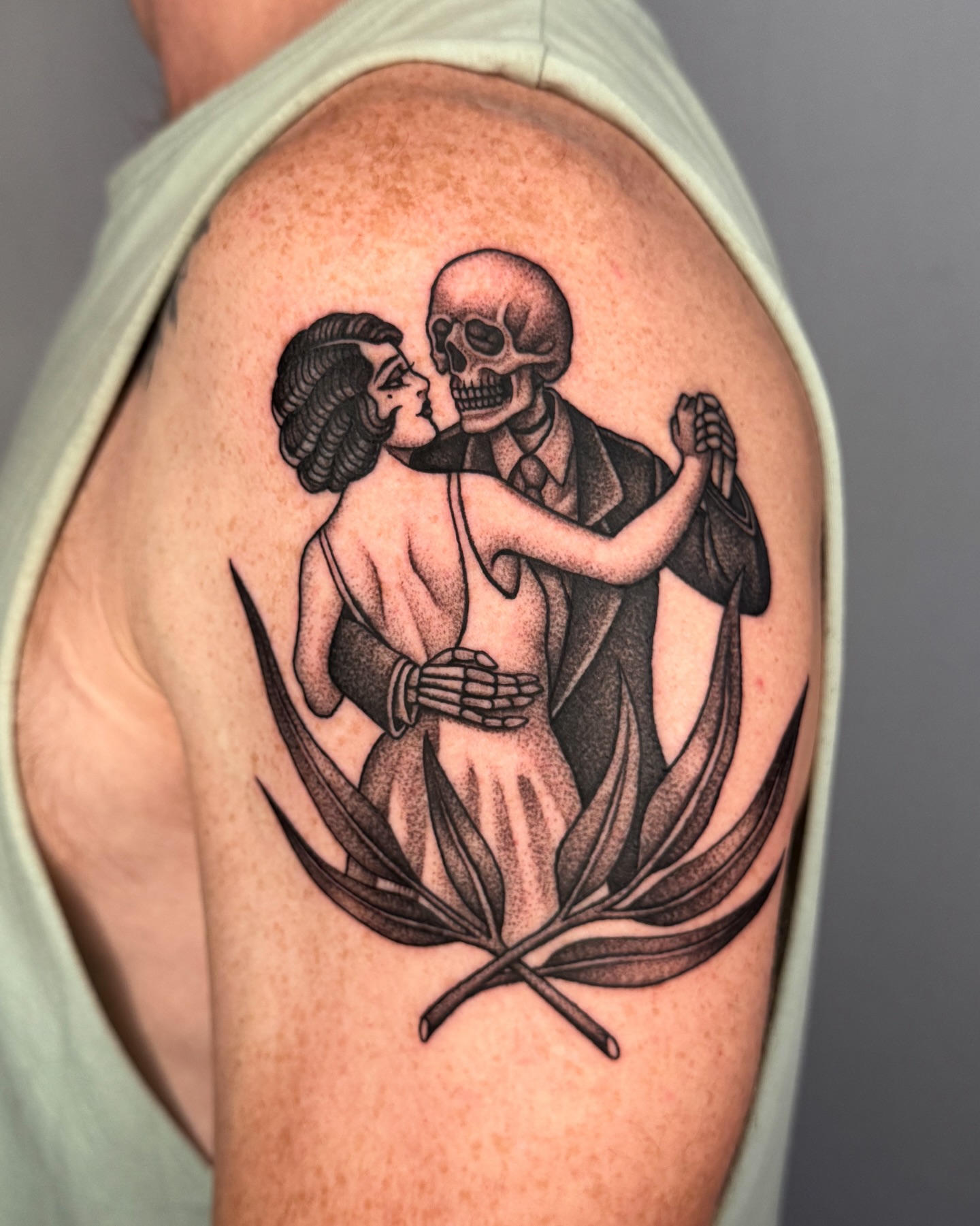 Dancing couple realism tattoo on the shoulder by Jae Traditional Tattoo