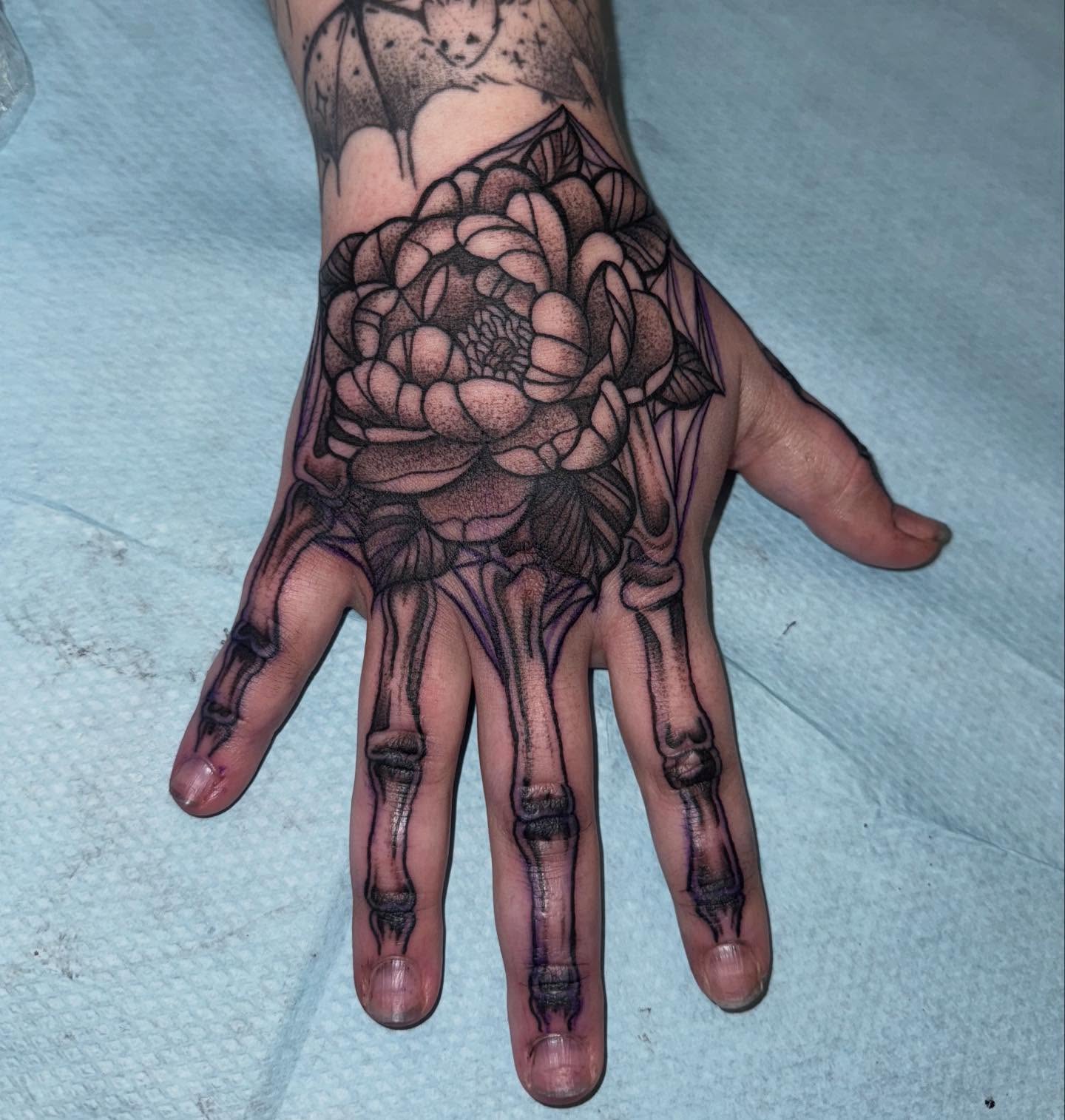 Peony black and grey tattoo on the hand by Laurito