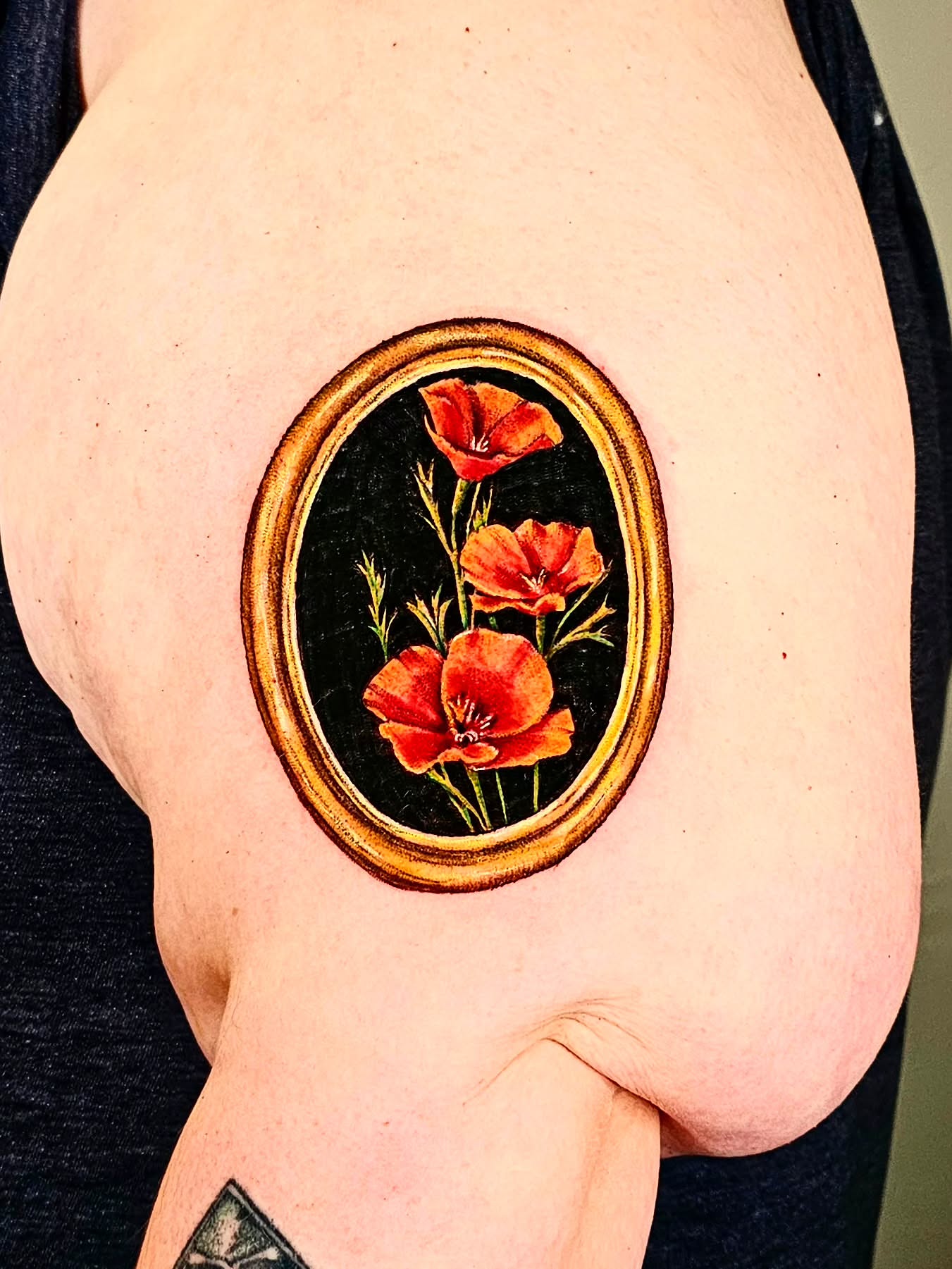 Red poppies realism tattoo on the shoulder by Madelynne