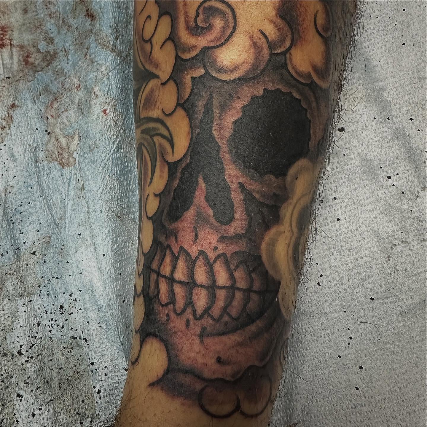 Skull realism tattoo on the forearm by Devin Spenny
