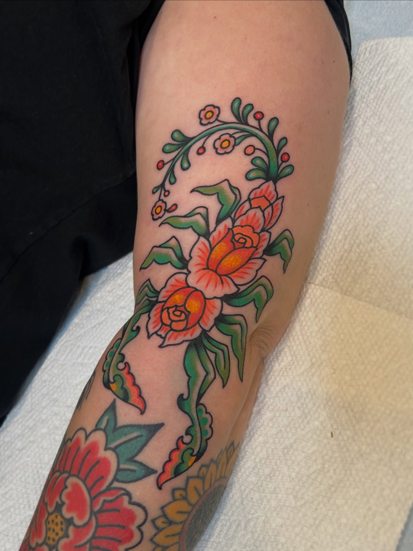Floral bouquet American traditional tattoo on the forearm by Lauren Alexandra