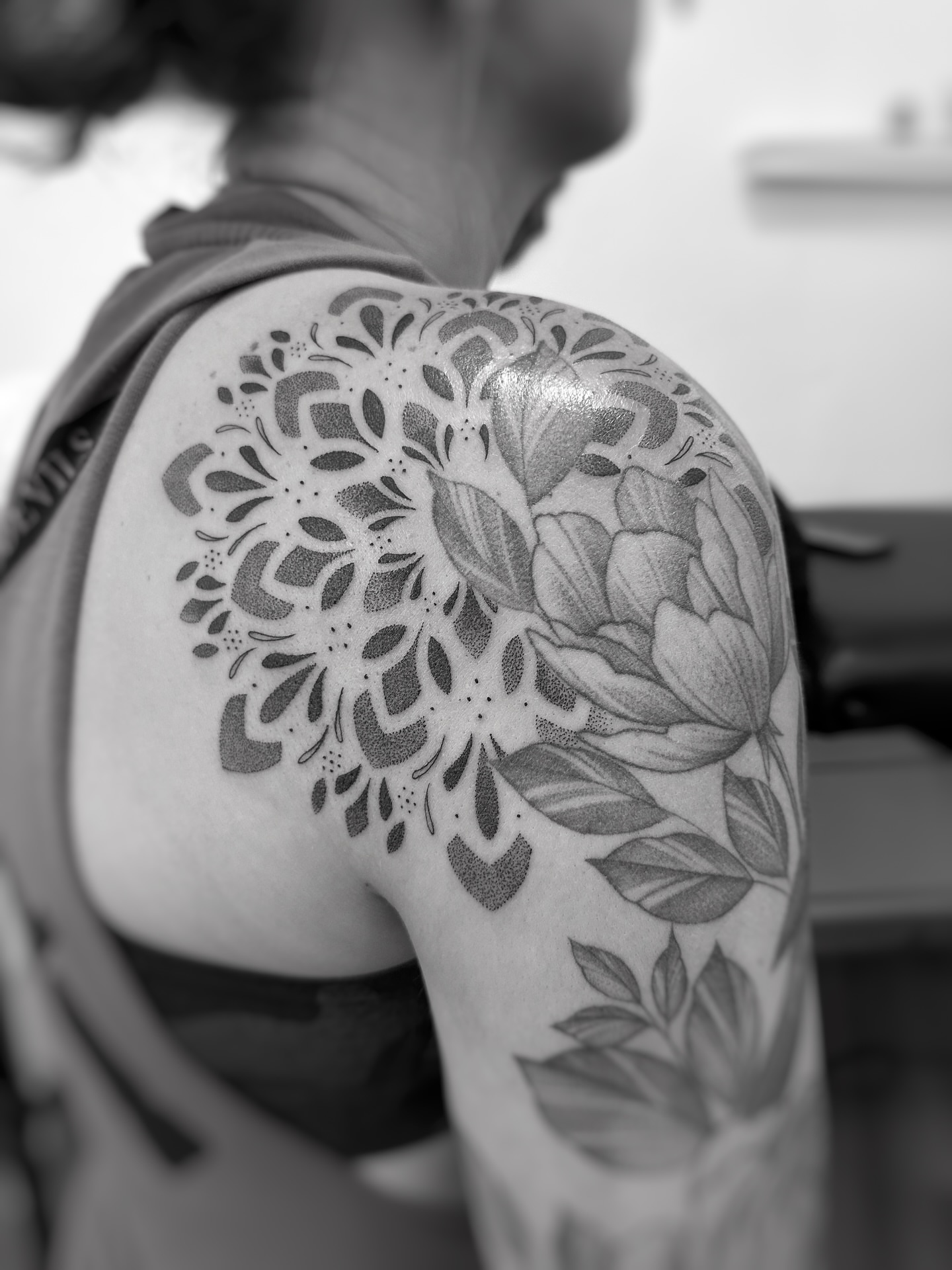 Floral design black and grey tattoo on the shoulder by jaclyn park