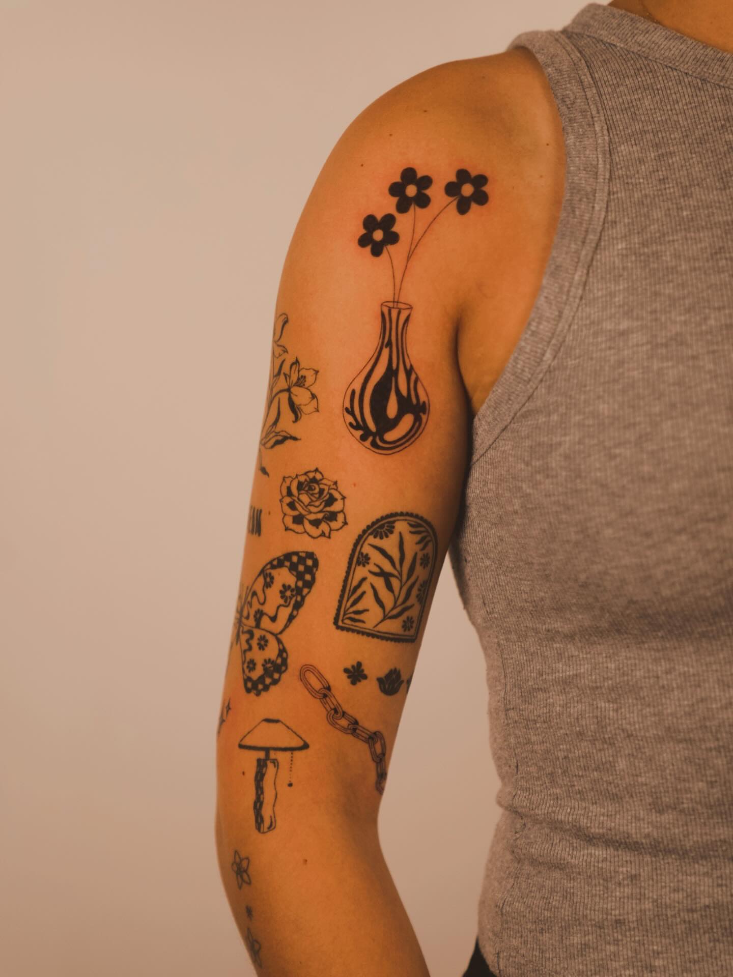 Flowers in vase black and grey tattoo on the forearm by b i l l i e, Seattle, Washington