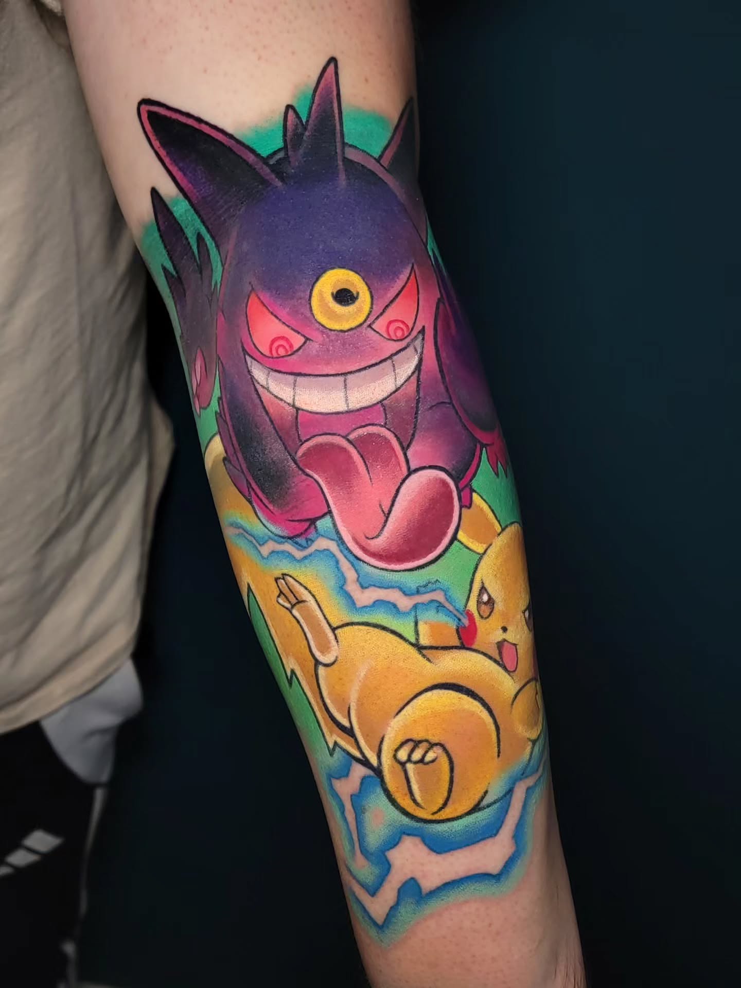 Gengar and Pikachu dotwork tattoo on the forearm by Melissa Does Tattoos - Bright, Bold Anime &